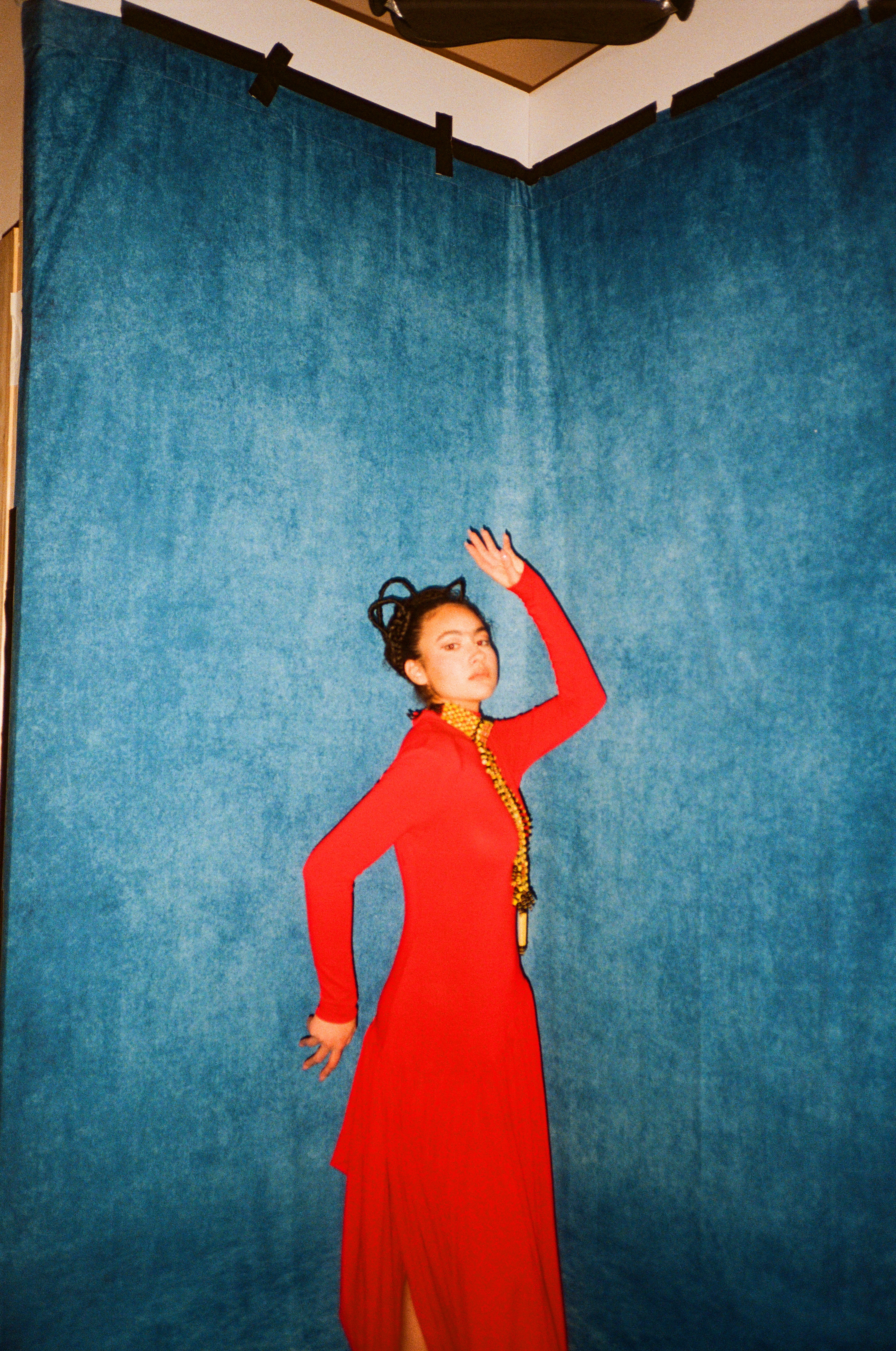 Woman with red hair covering mouth with hair