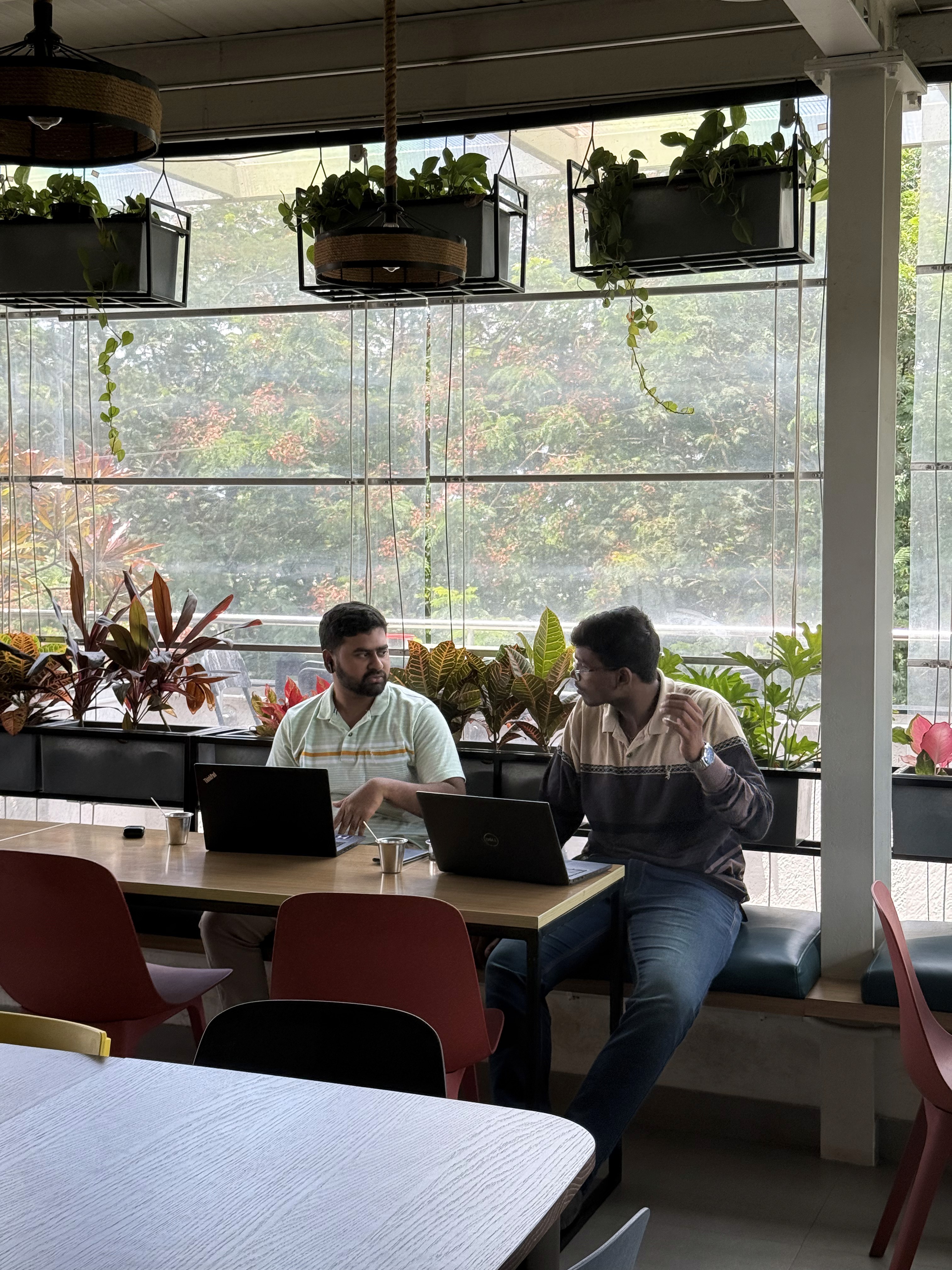 a person holding a small bowl of food