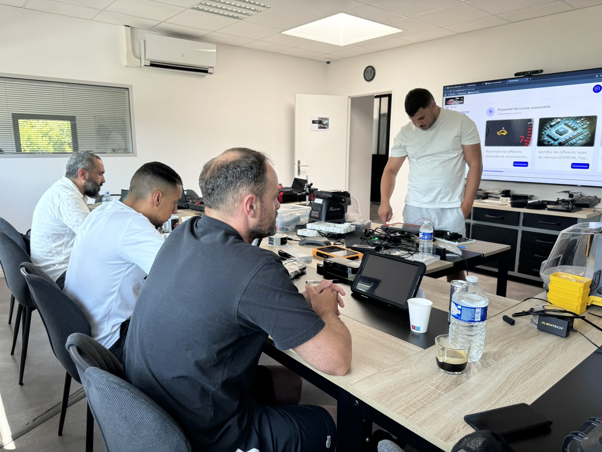 Group of men standing with Sufboard