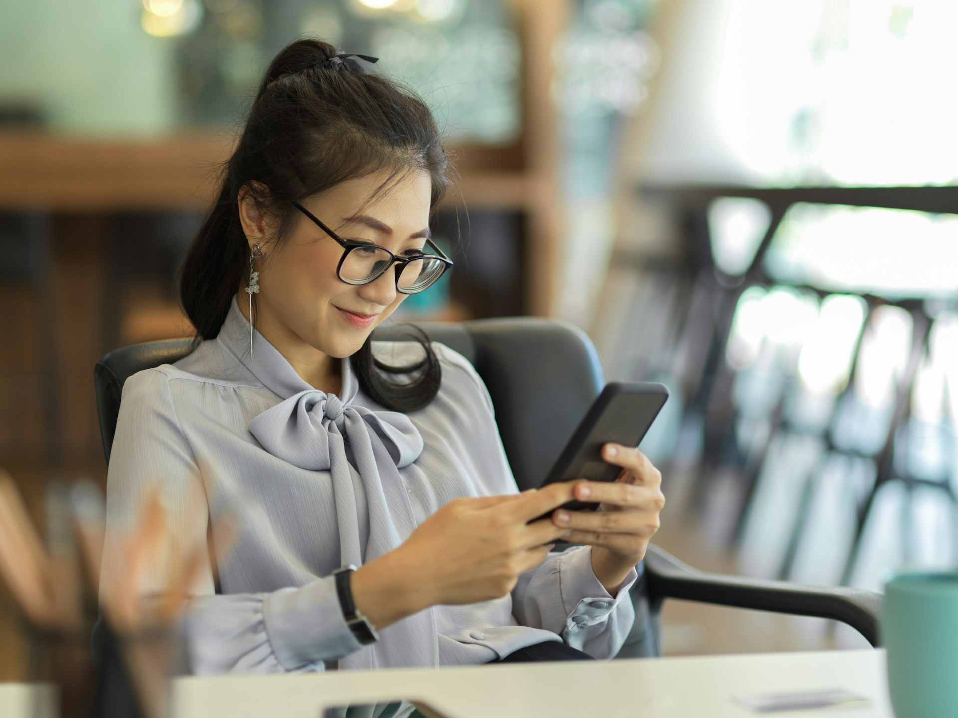 A woman holding a phone