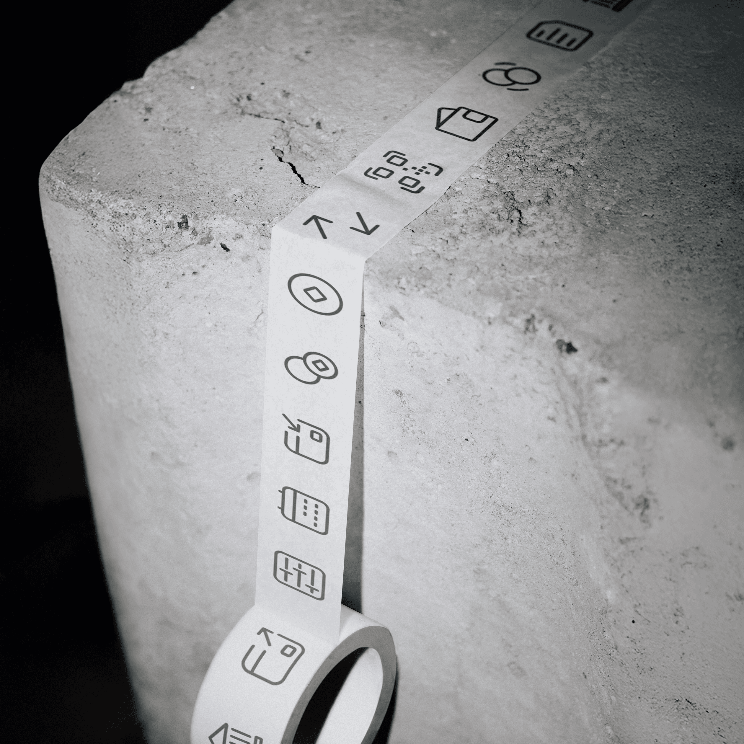 A selection of icons from the set designed by ofc. Studio for Adriatic Crypto Exchange, presented in a form of a duct tape with icons printed on it.