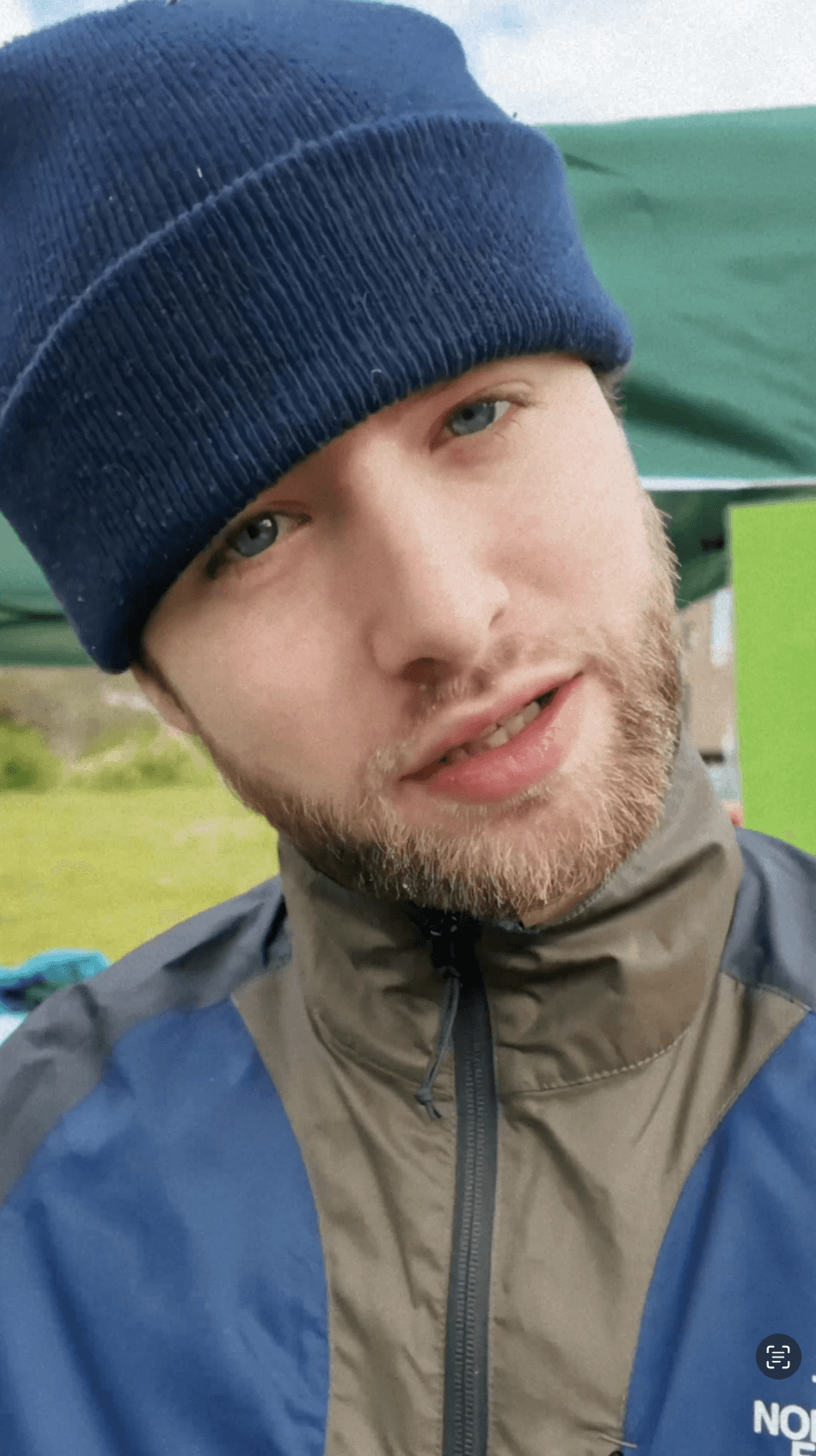 Close-up of bride and groom's torsos, bride in white dress