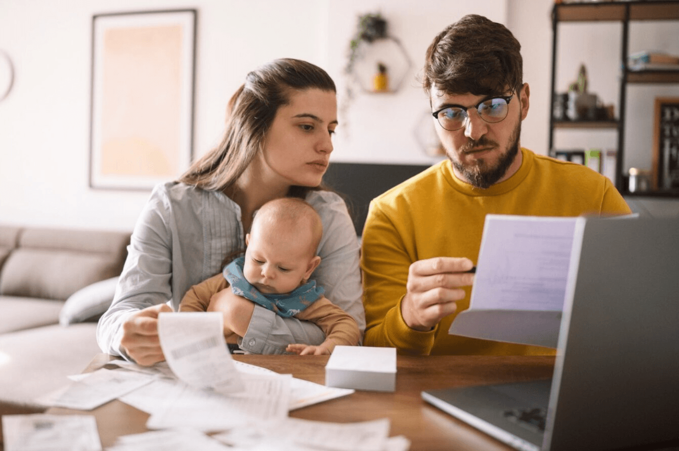 couple doing paperwork and computing taxes