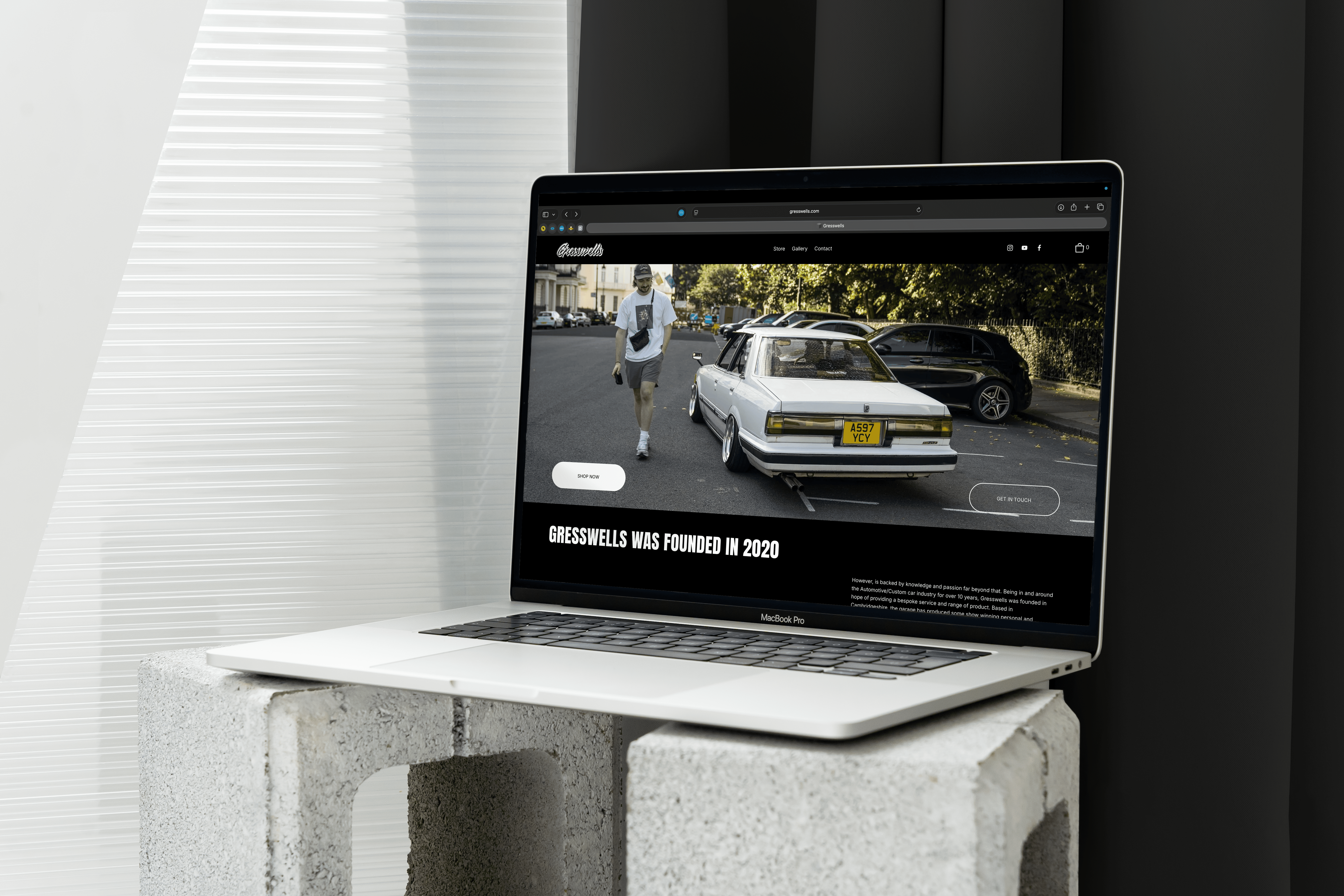 Mockup of a laptop with a Gresswells page open