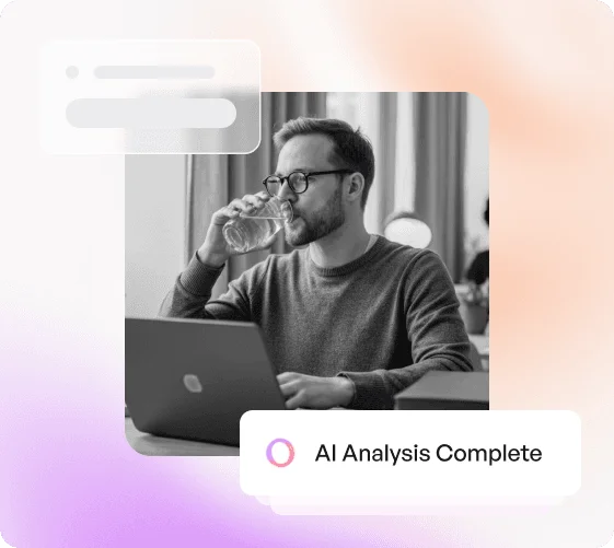 A man with glasses sits at a table, sipping water while working on a laptop, with an overlay indicating "AI Analysis Complete" and a gradient background adding a modern touch.