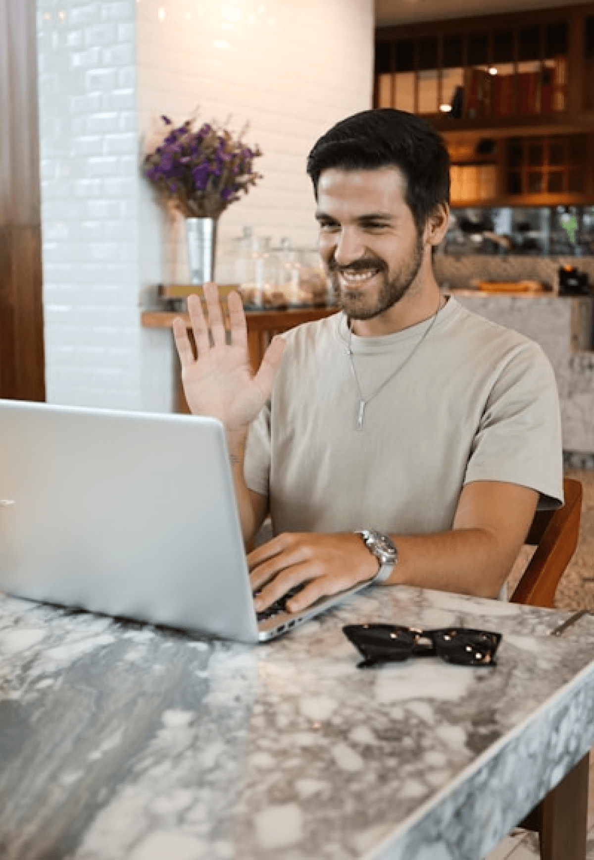 a man doing a video call on a laptop