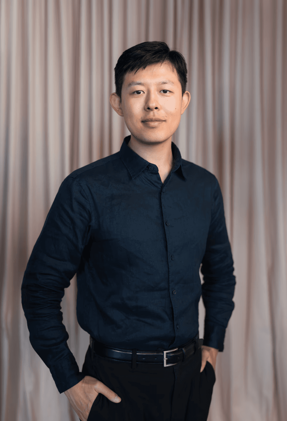 man standing beside wall