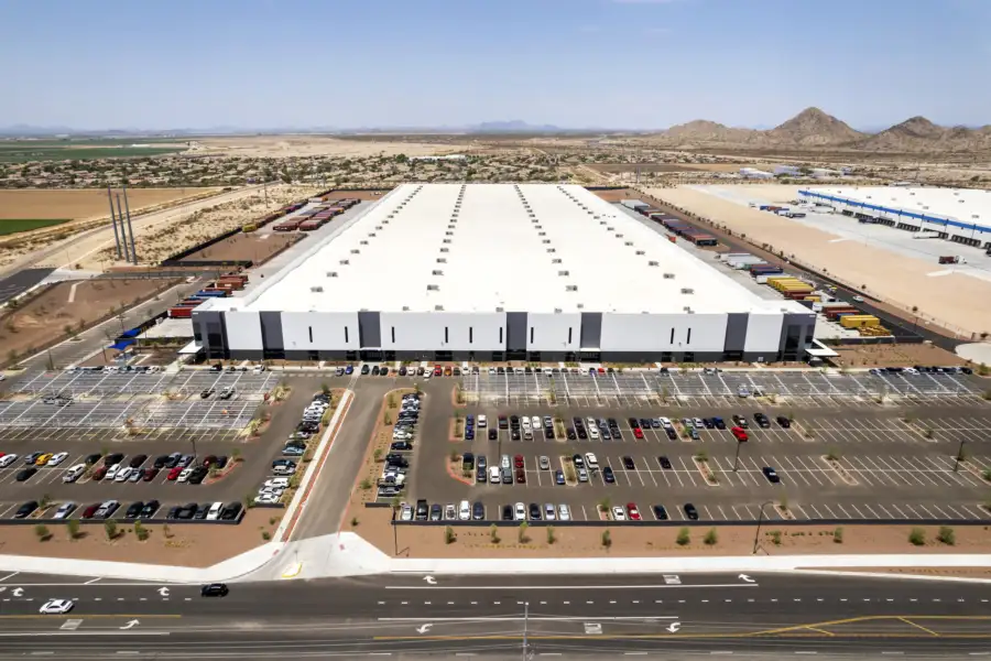 Loading docks at 10 West Commerce with containers, trailers and blue shade sails in Buckeye, Arizona