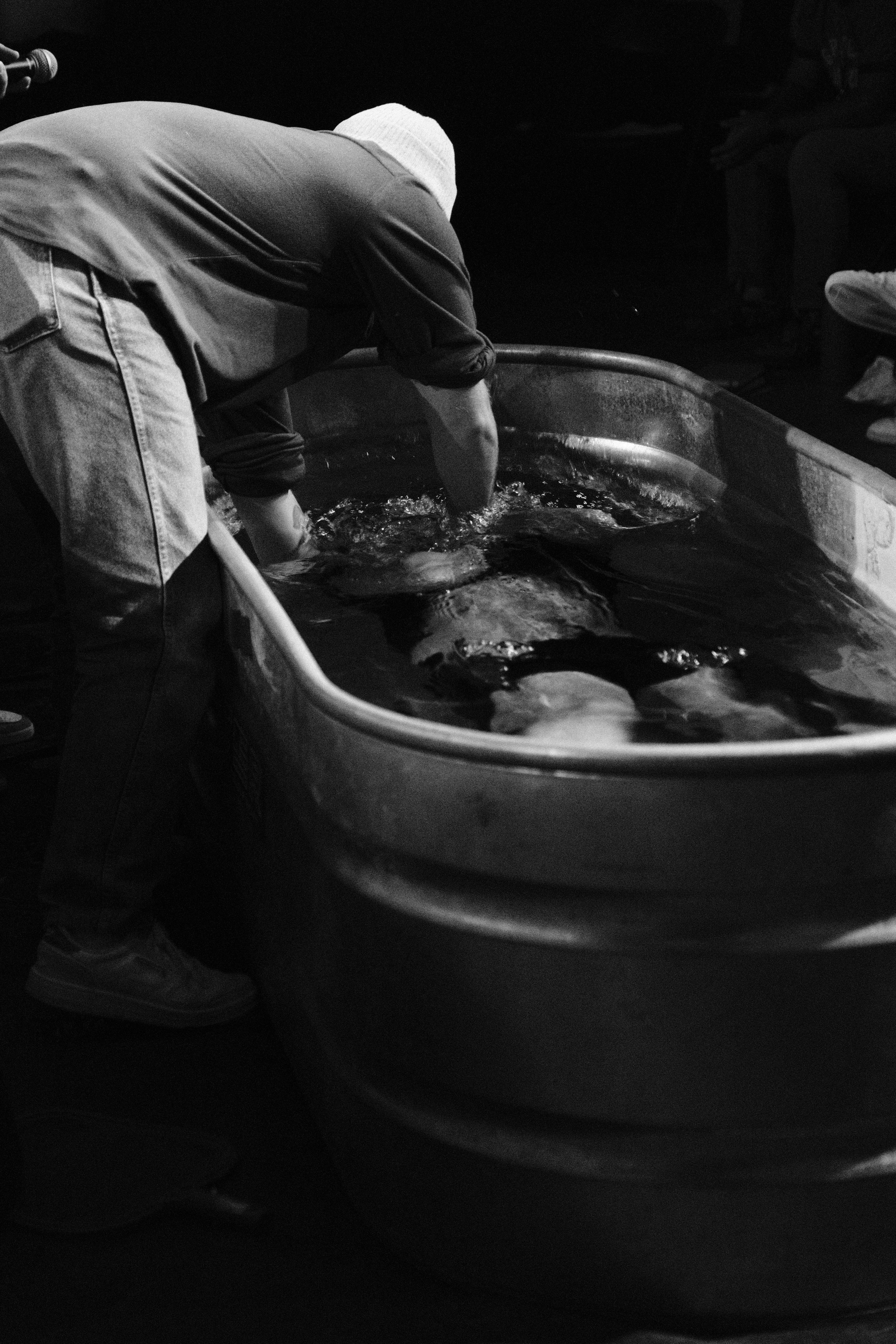 a person in the baptism tank after getting baptised