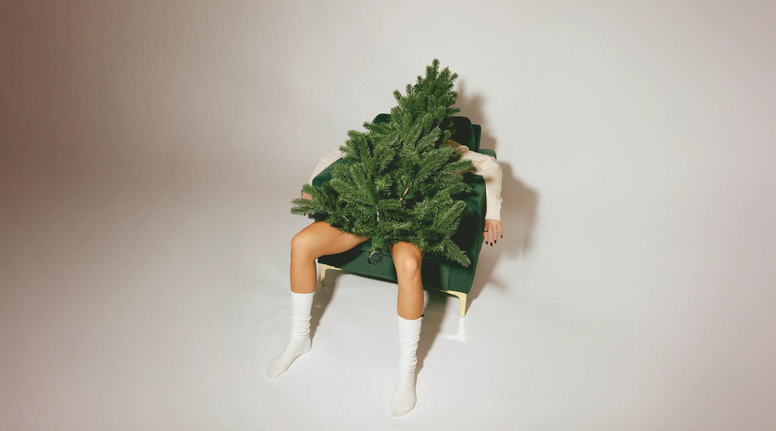 Woman wears a blue coat in a blue environment.