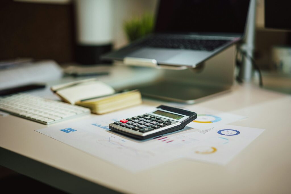 Desk with Calculator and Papers