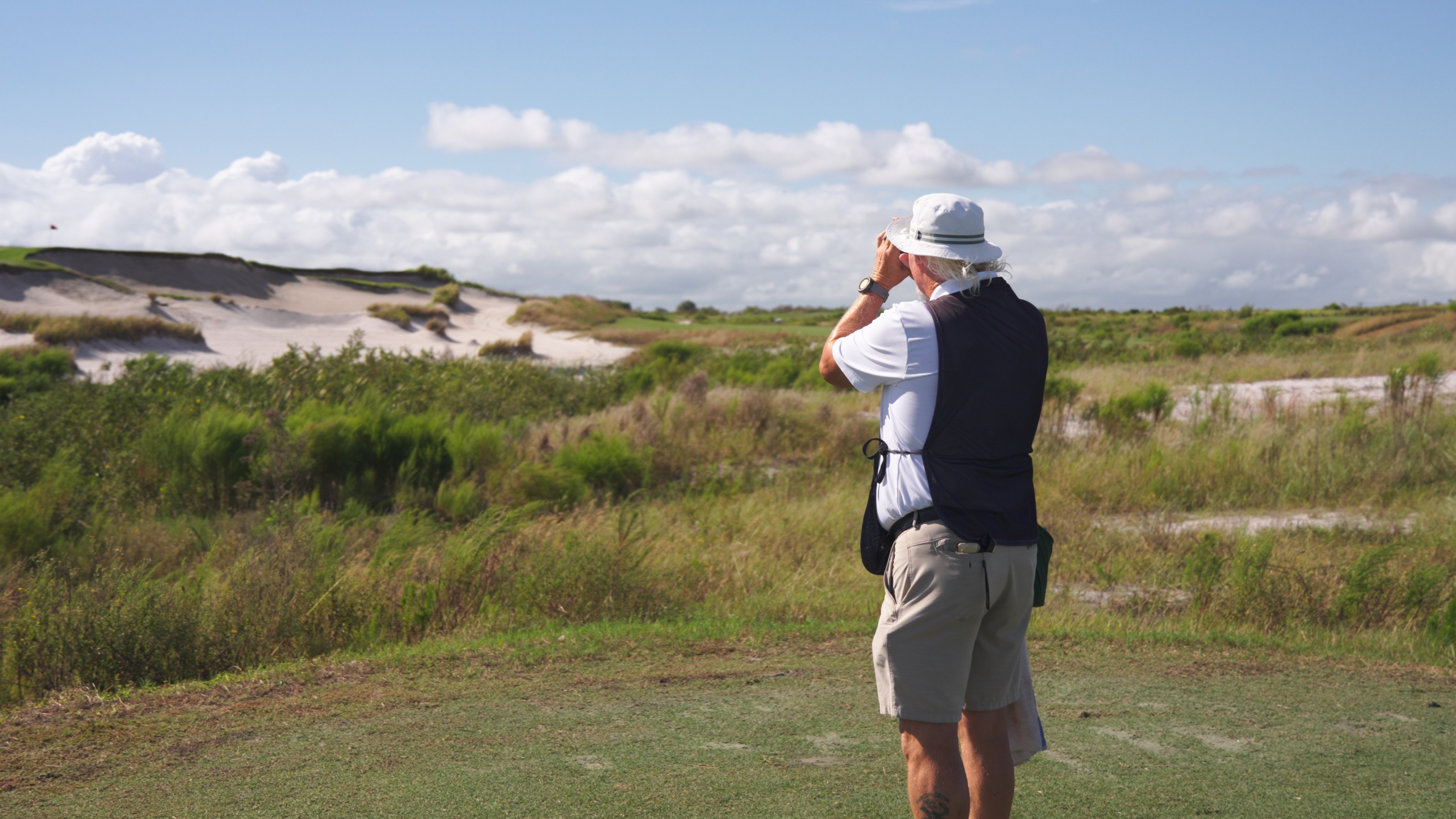 Player hitting iron shot