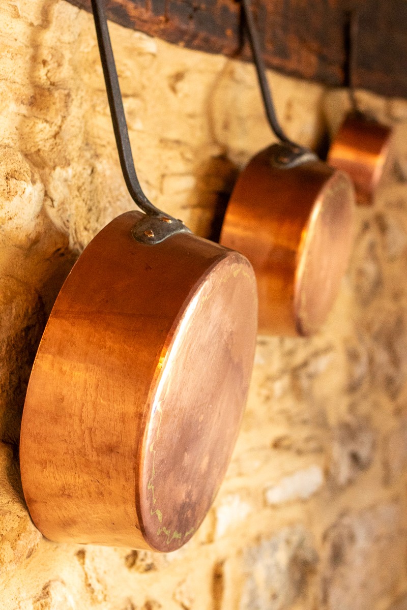 Bottles of olive standing on the marble counter