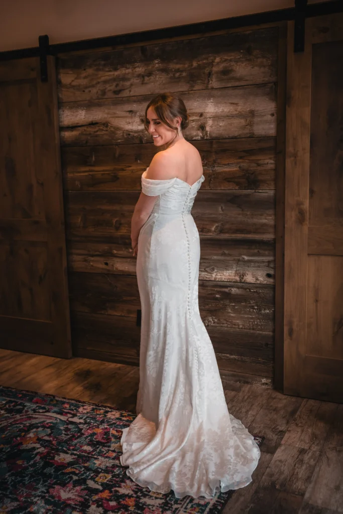 Bride portrait by rustic cabin at Carbondale Private Ranch Wedding