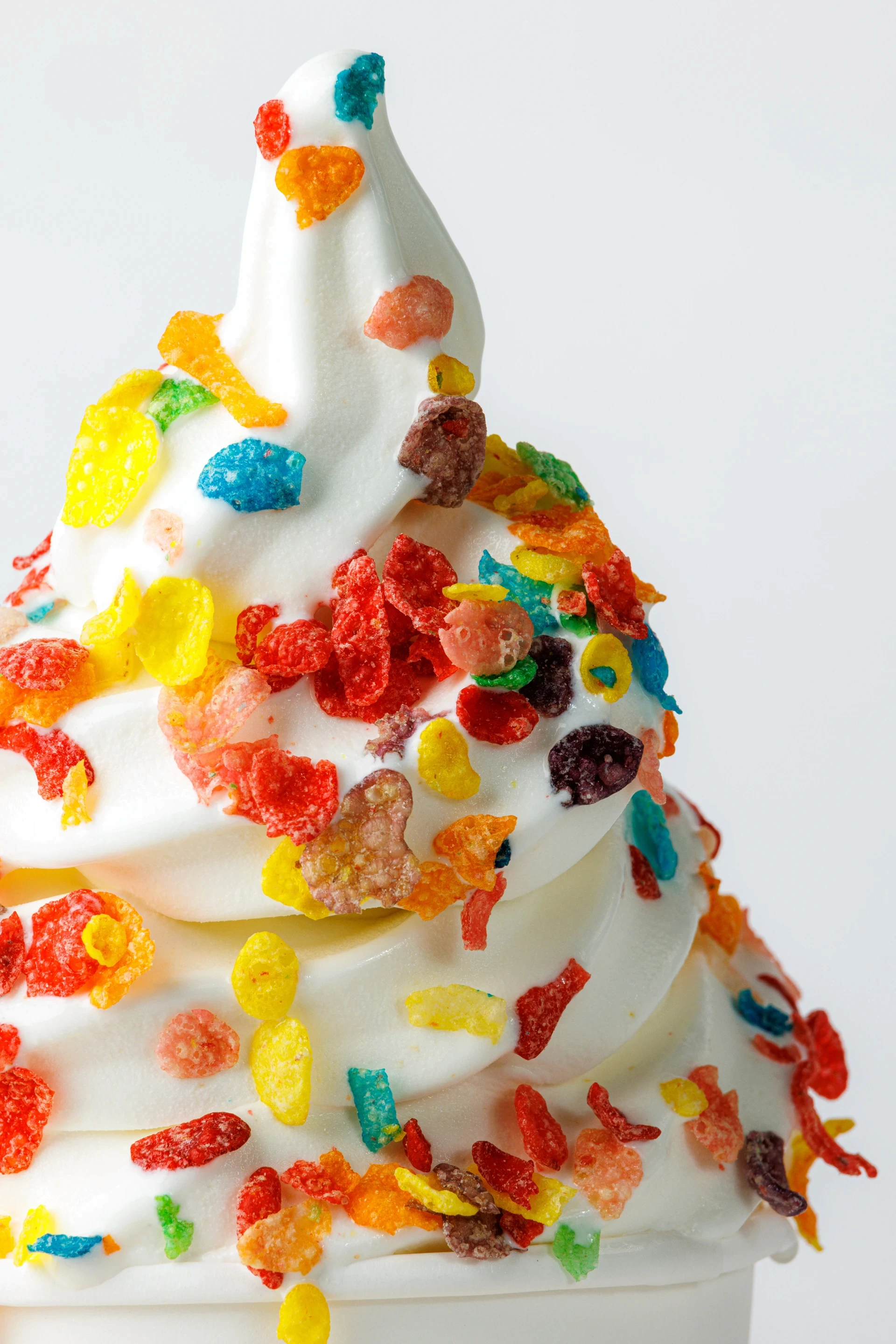Close up view of ice cream covered in colorful sprinkles.