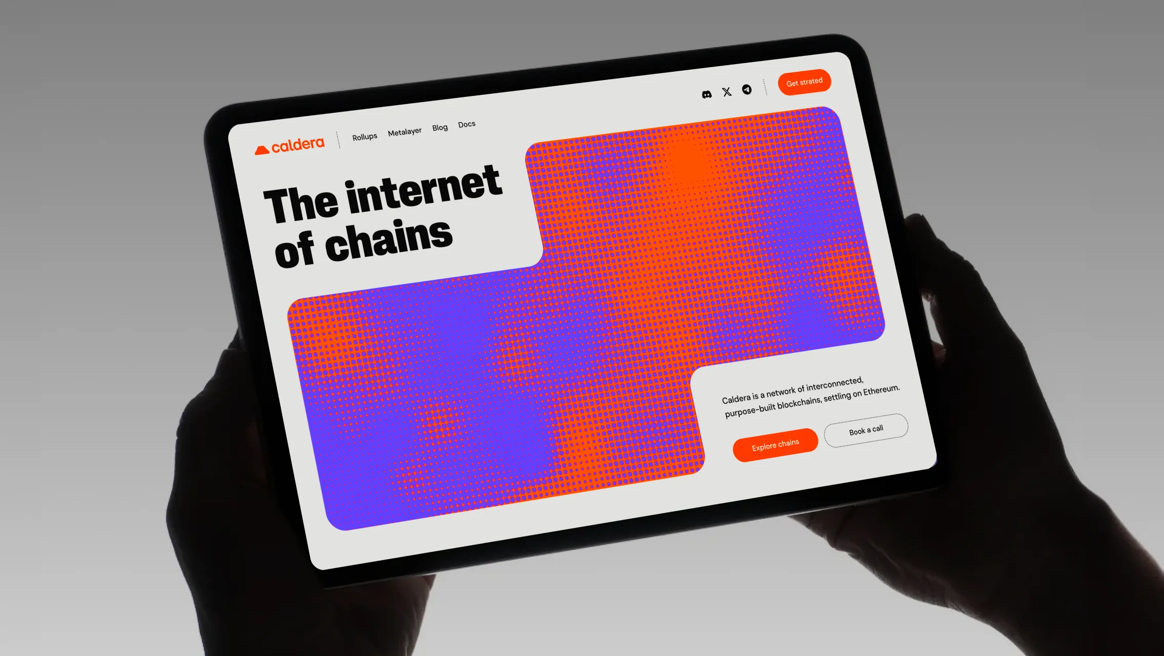 Two hands holding a tablet showing Caldera's website, headlined "The internet of chains", with a large orange and blue halftone gradient graphic
