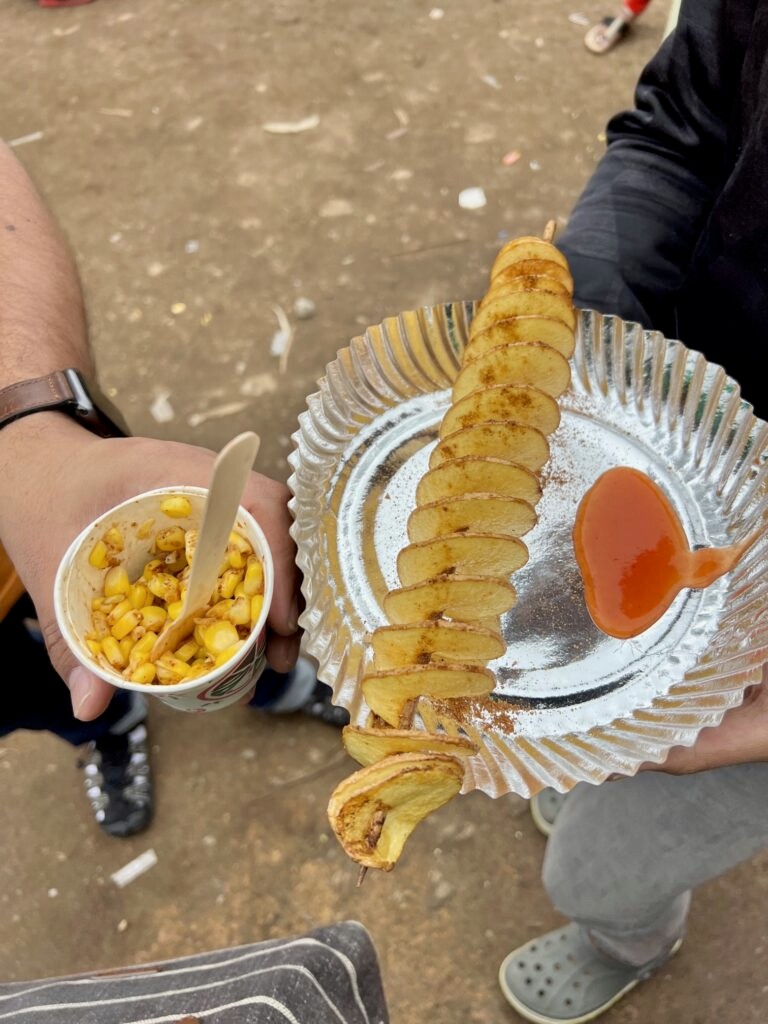 Masala corn cup and potato twister served with ketchup in Kodaikanal