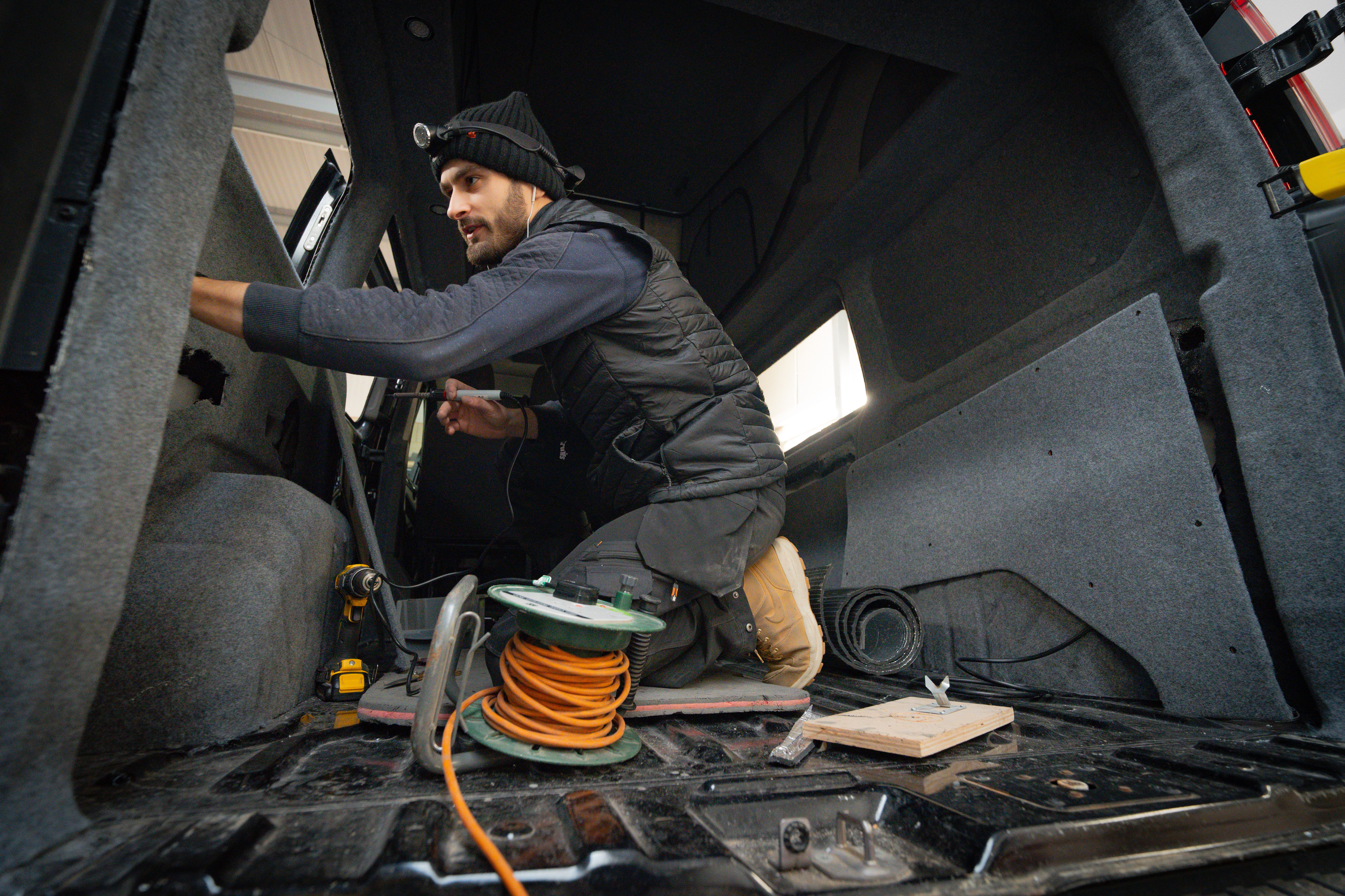 A Cosmic team member working inside a van at the Derby workshop