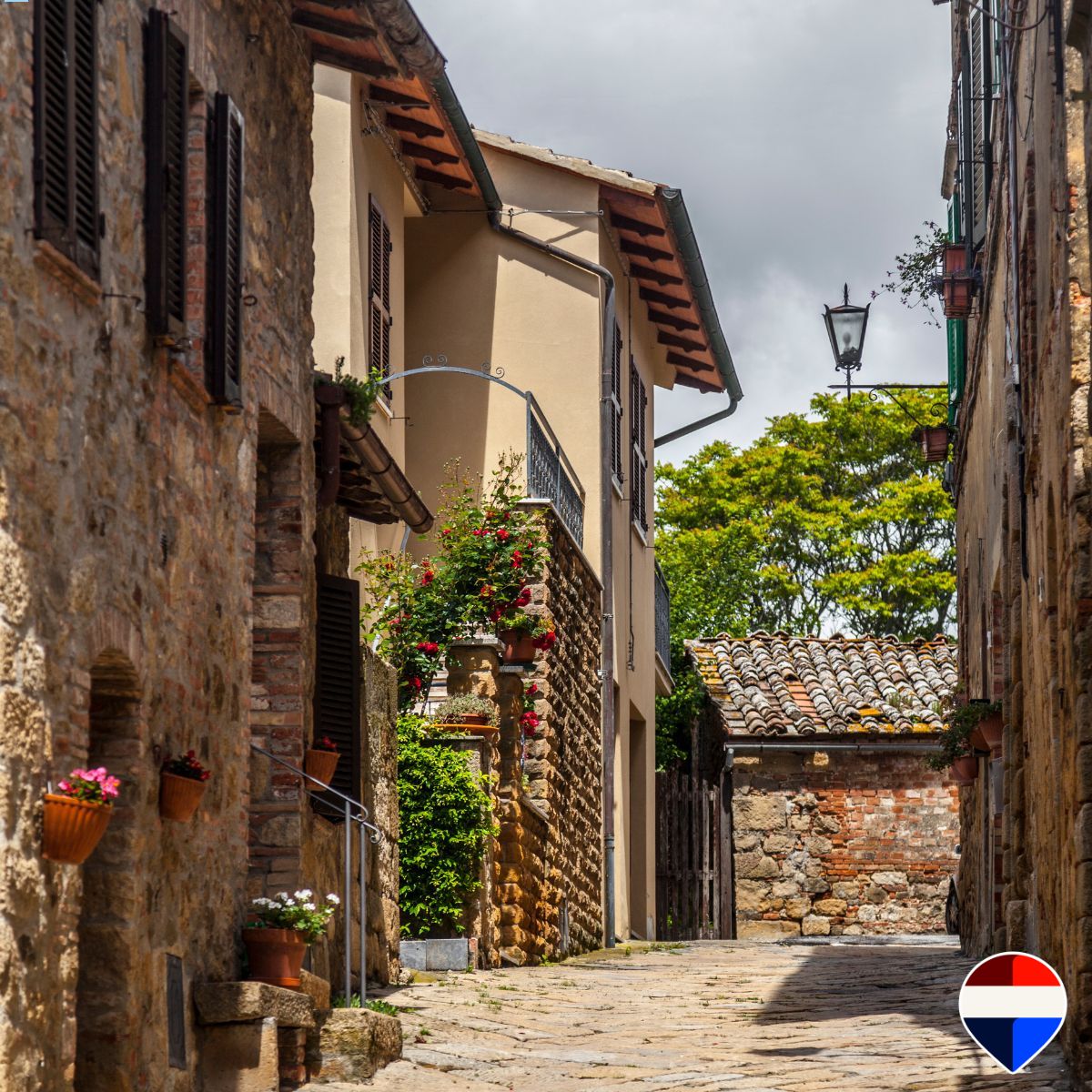 A stone house along a lane in a village of the Tuscan Maremma