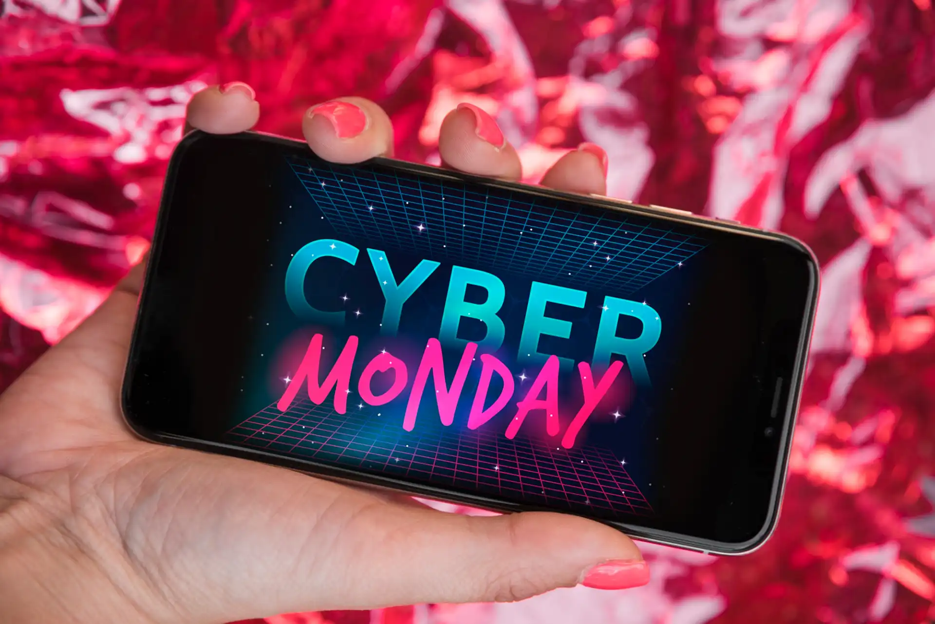 A smartphone displays "Cyber Monday" text, highlighting the TikTok Shop's major holiday shopping event.