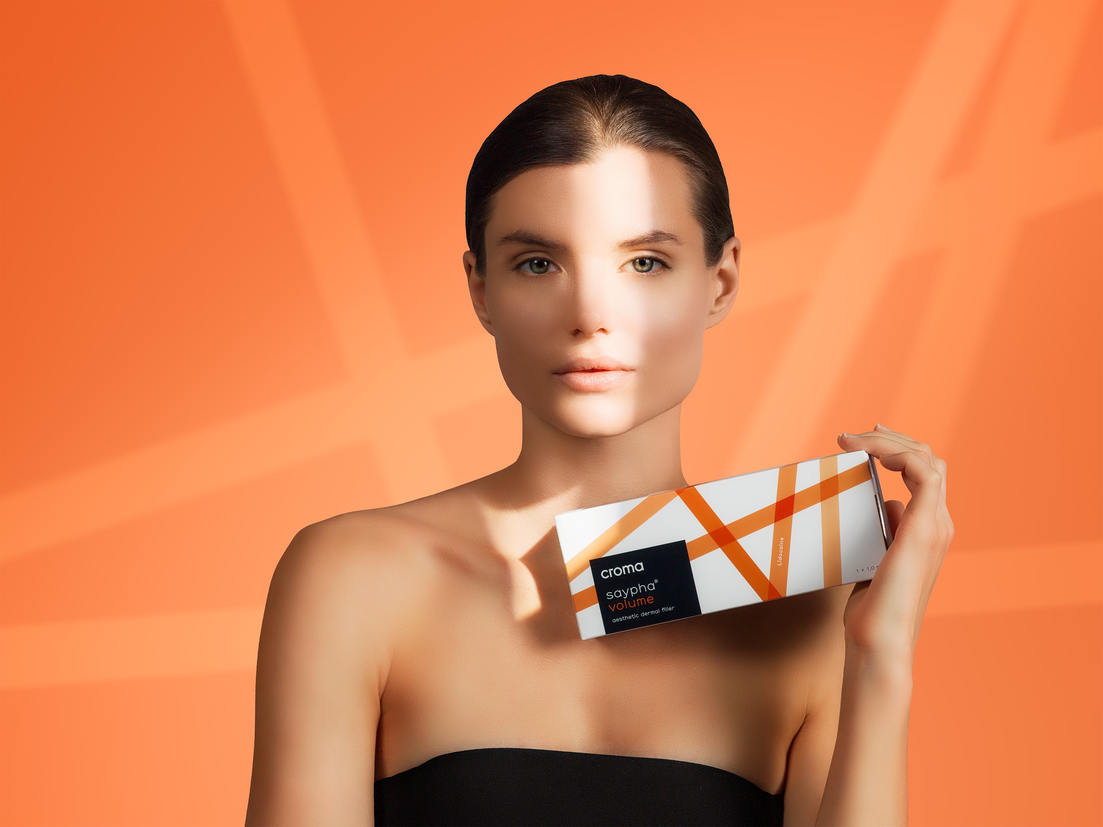 Croma Saypha Volume Lidocaine dermal filler product box with model Canada orange background