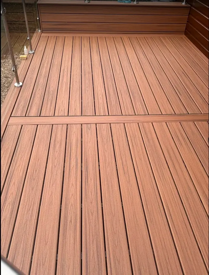 Warm brown Trex deck with built-in bench