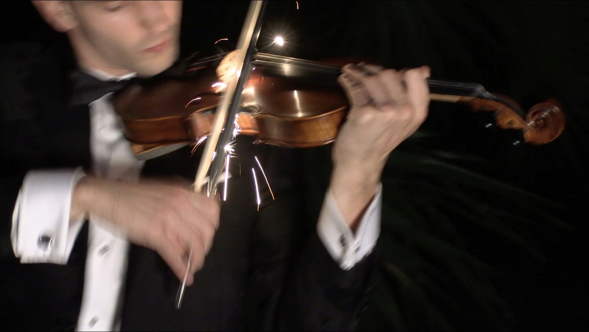 Marki Lucky's pyrotechnic violin throwing sparks on stage