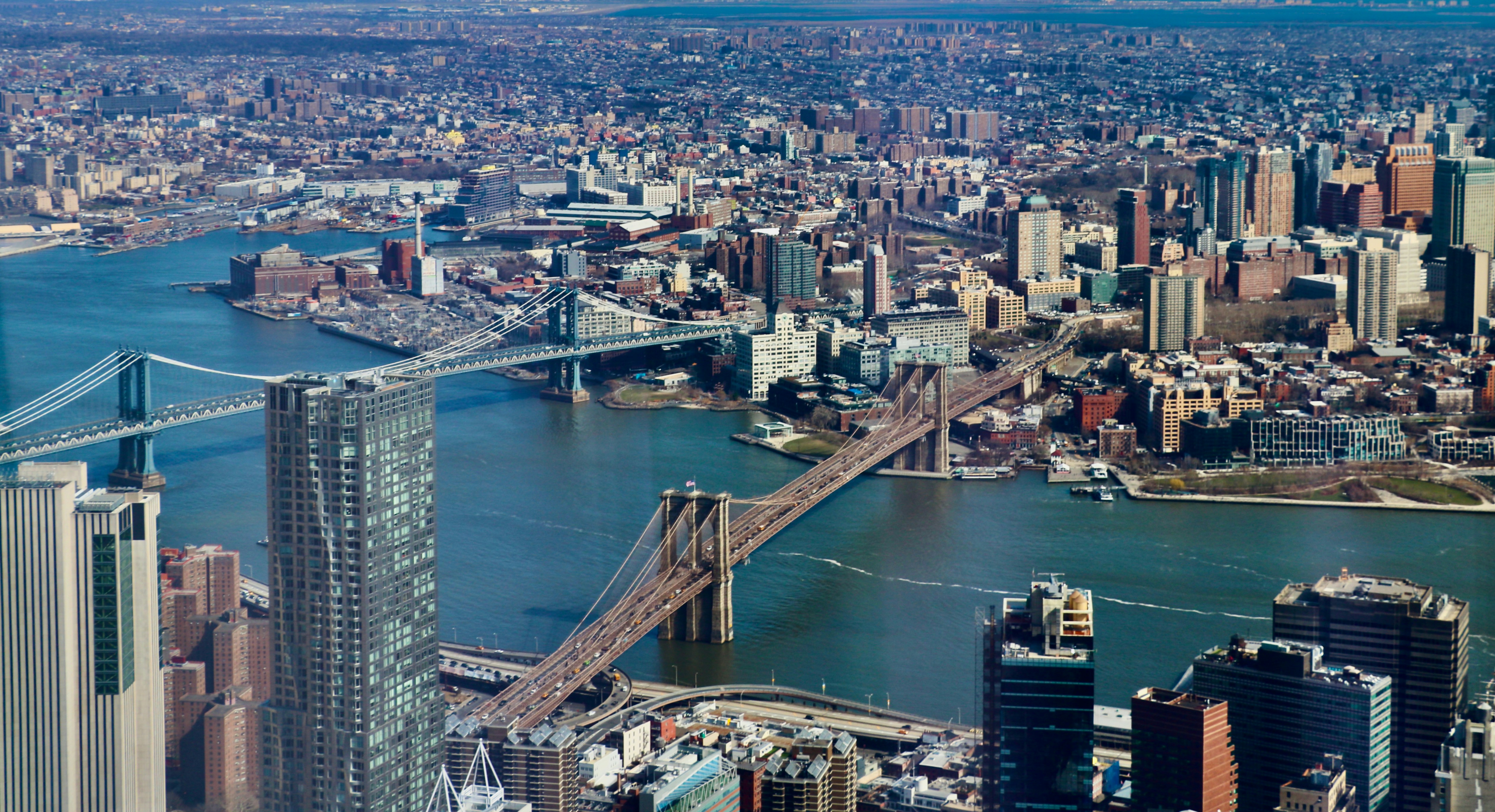 an aerial view of a city and a bridge