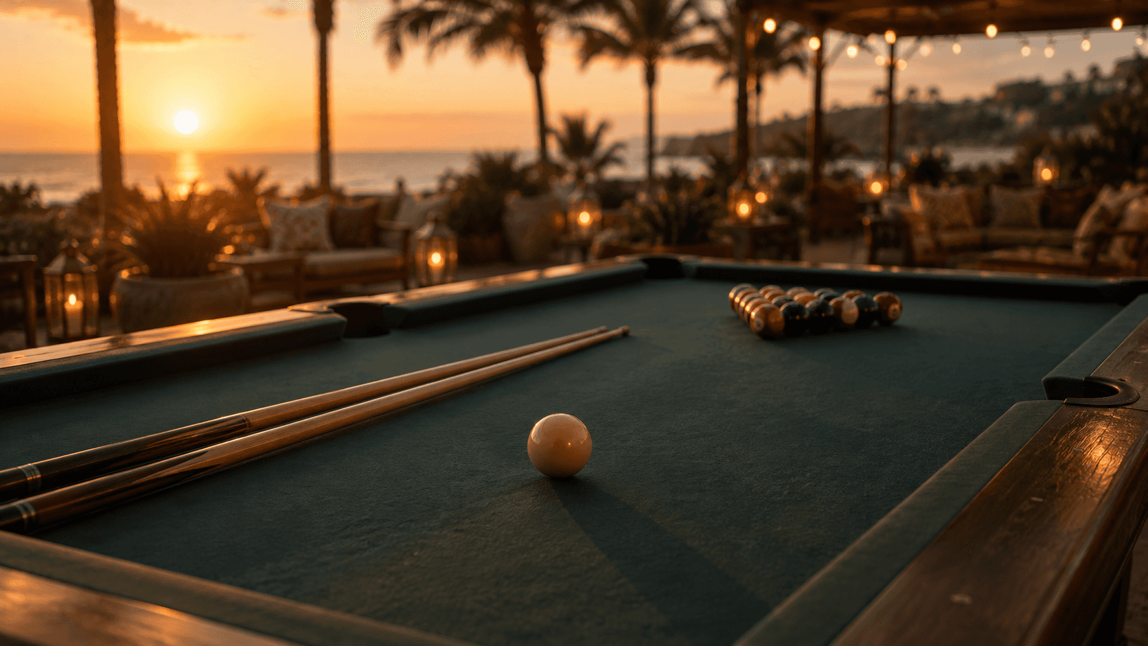 Open billiards table facing the ocean at sunset