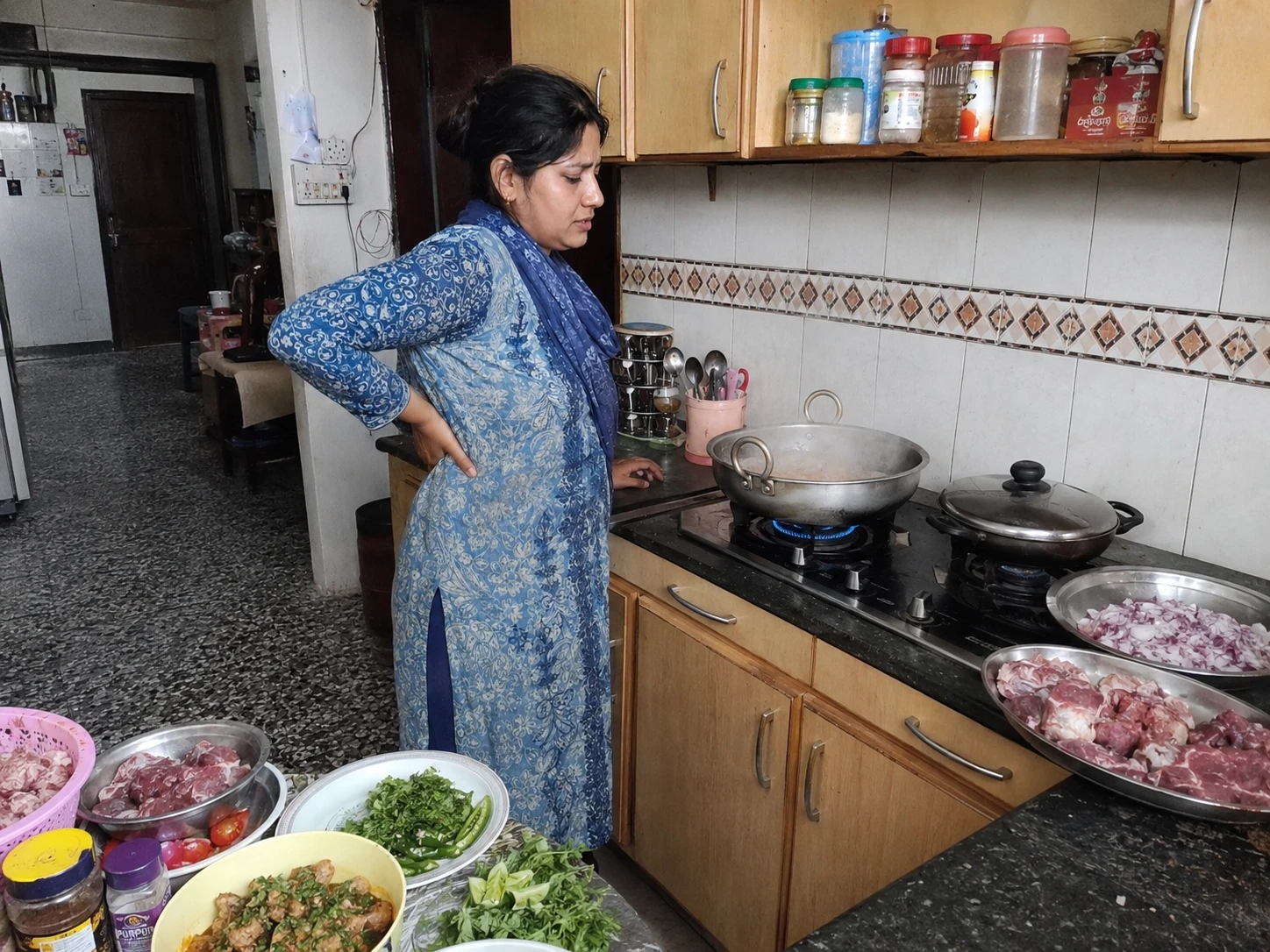 woman standing at stove on Eid Ul Adha