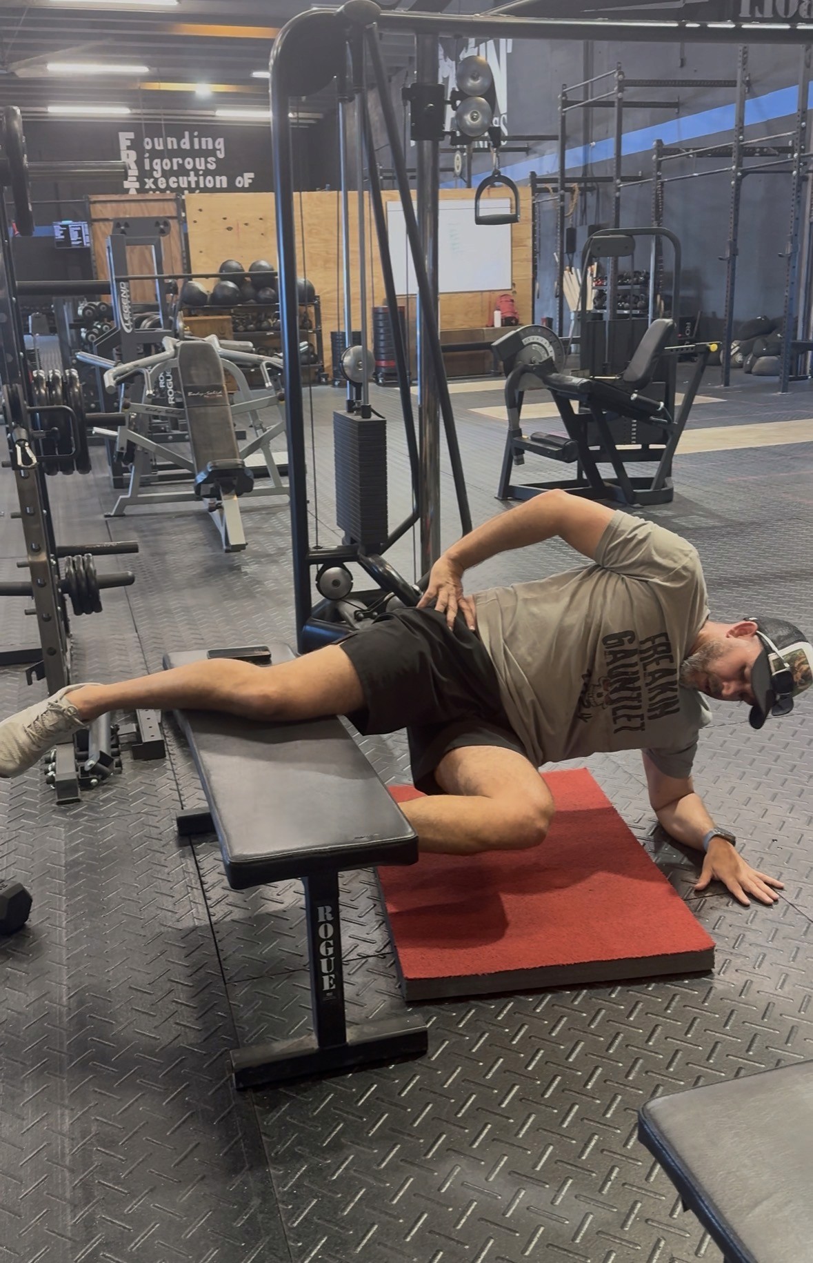 Male tennis player hitting a forehand on a clay court, showcasing explosive movement, precision, and athletic performance in competitive sports training.