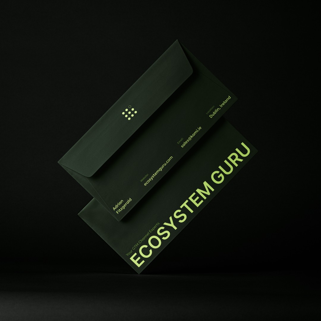 Modern home office setup with a monitor, ergonomic chair, keyboard, and indoor plants near a window with blinds.