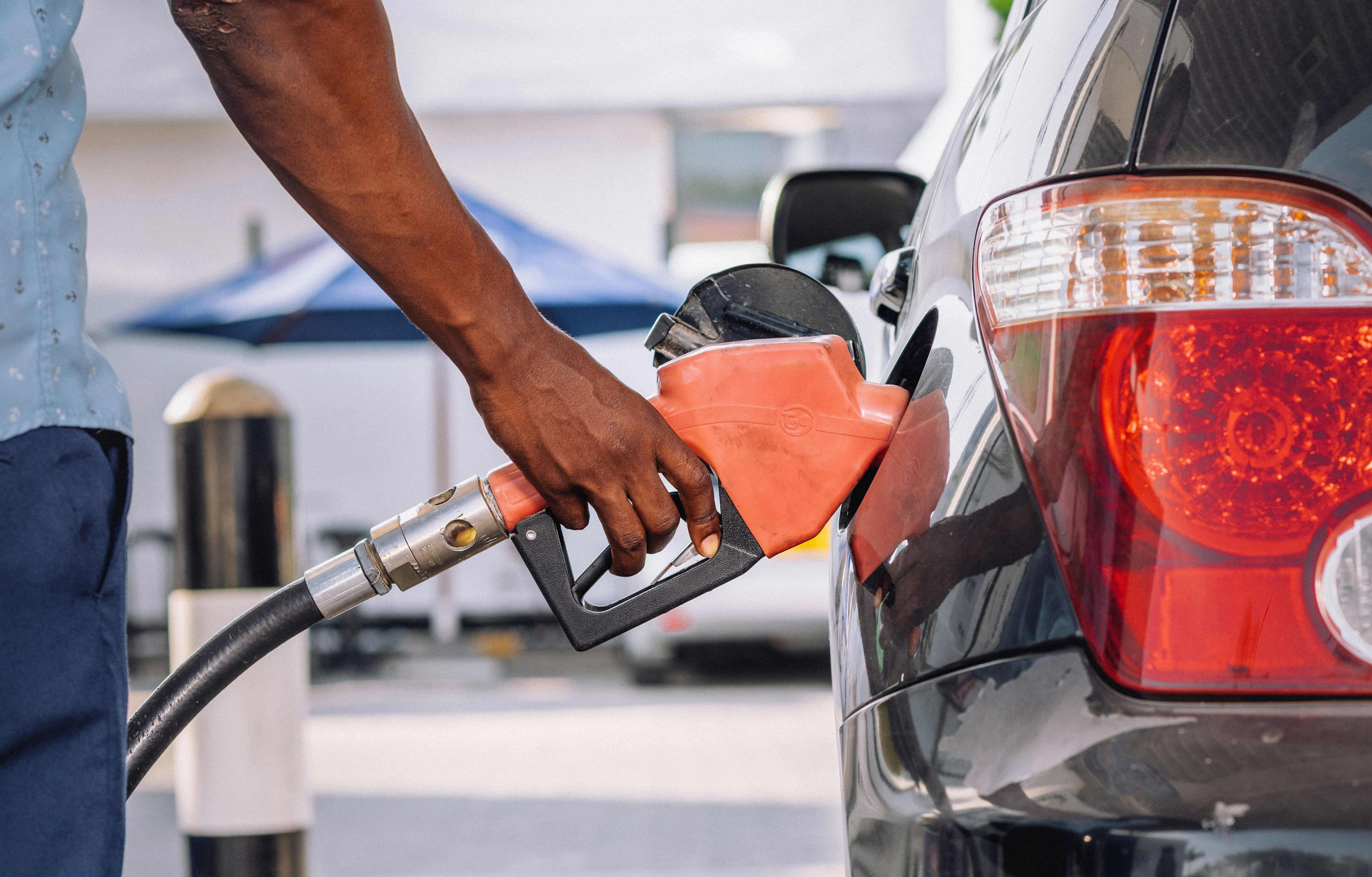 A man filling his car with gas