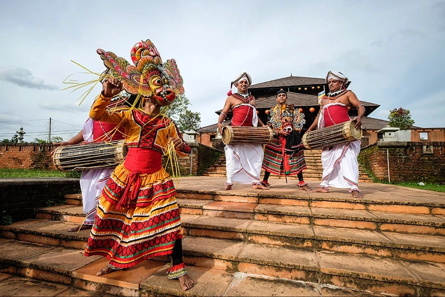 Traditional masked dance with drummers