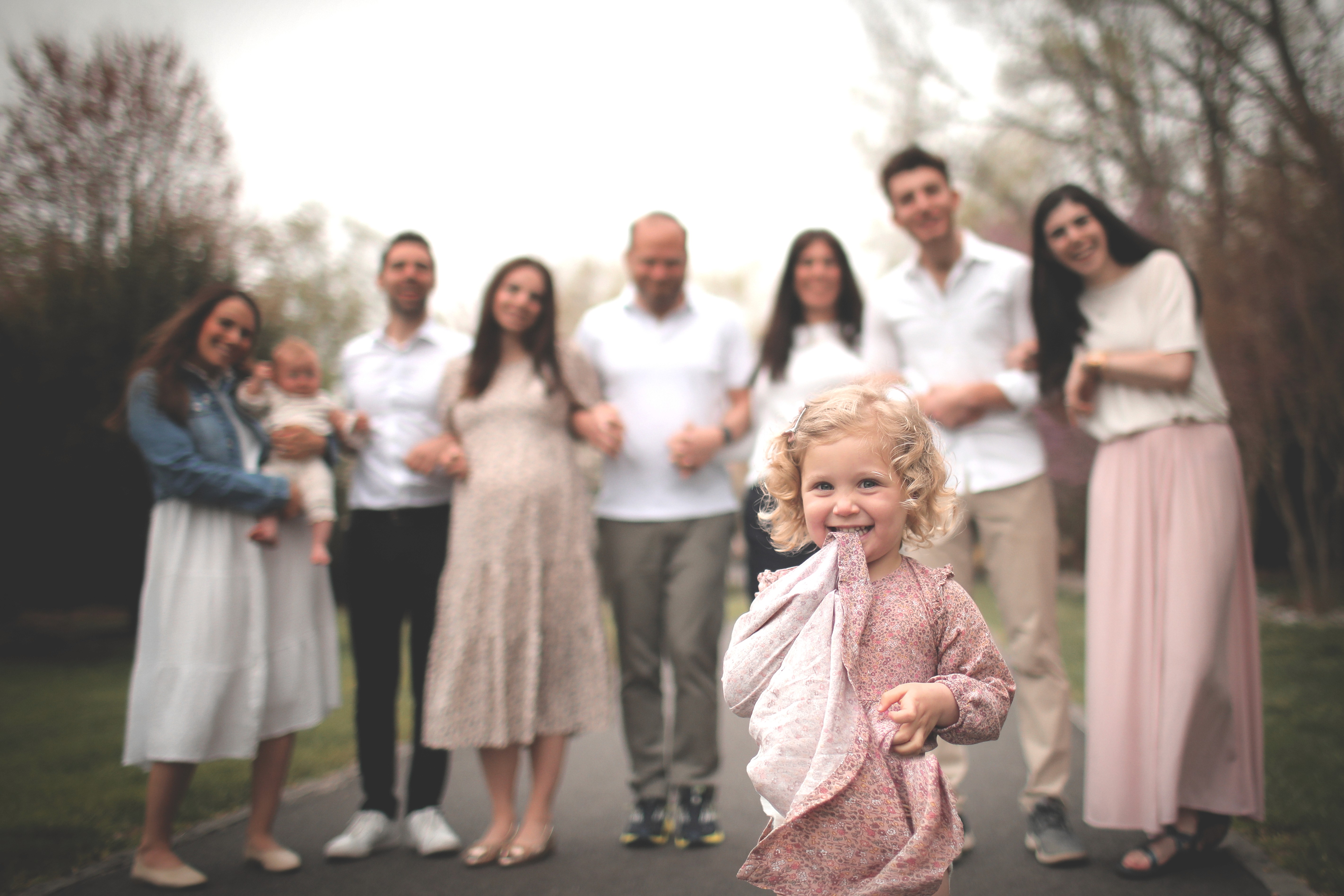 Family walking together in a park during a relaxed lifestyle photoshoot in San Diego.