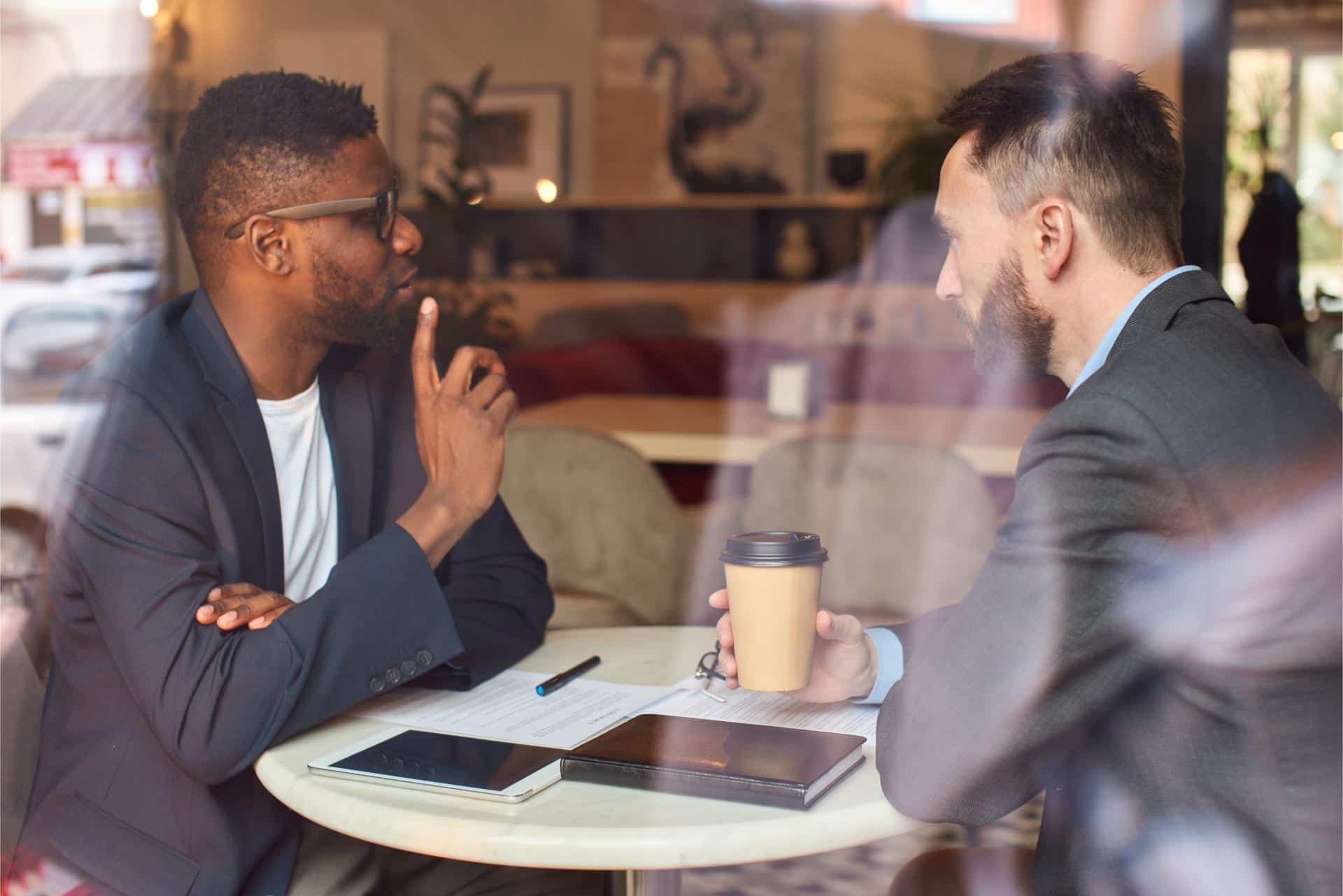 Two businessmen having a meeting in the cafe