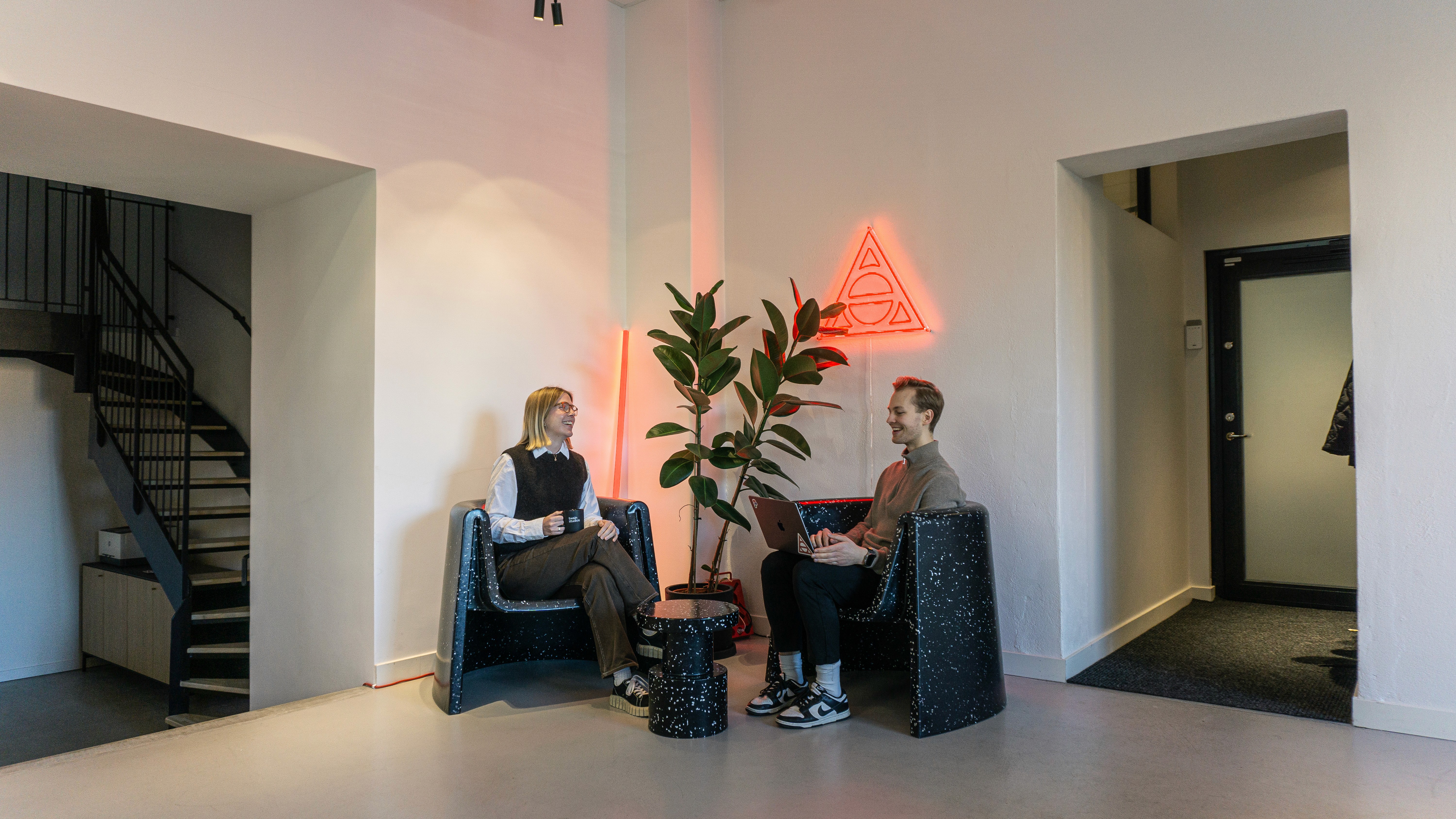 Meeting room with table and chairs.