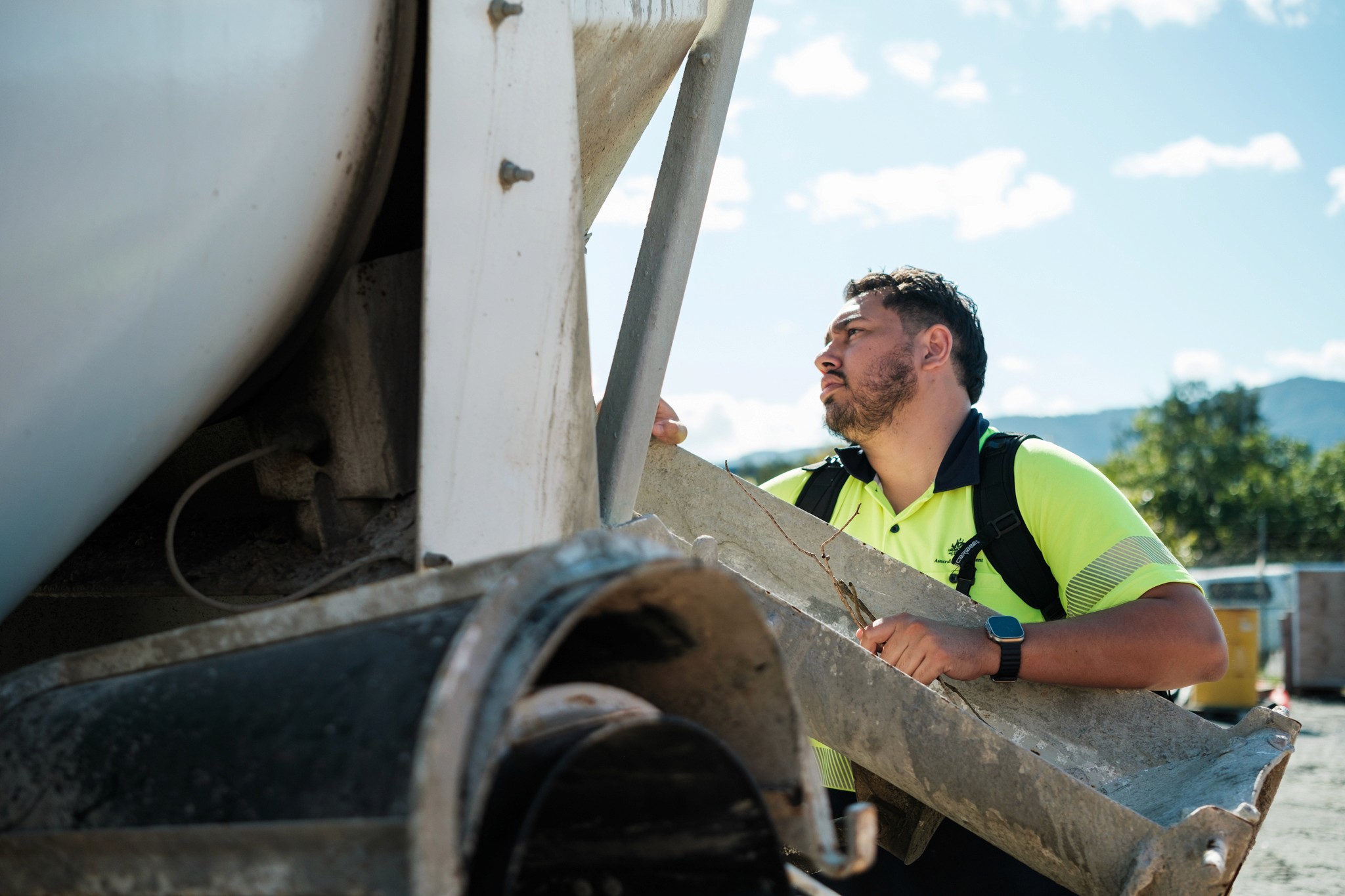 A man inspects machinery