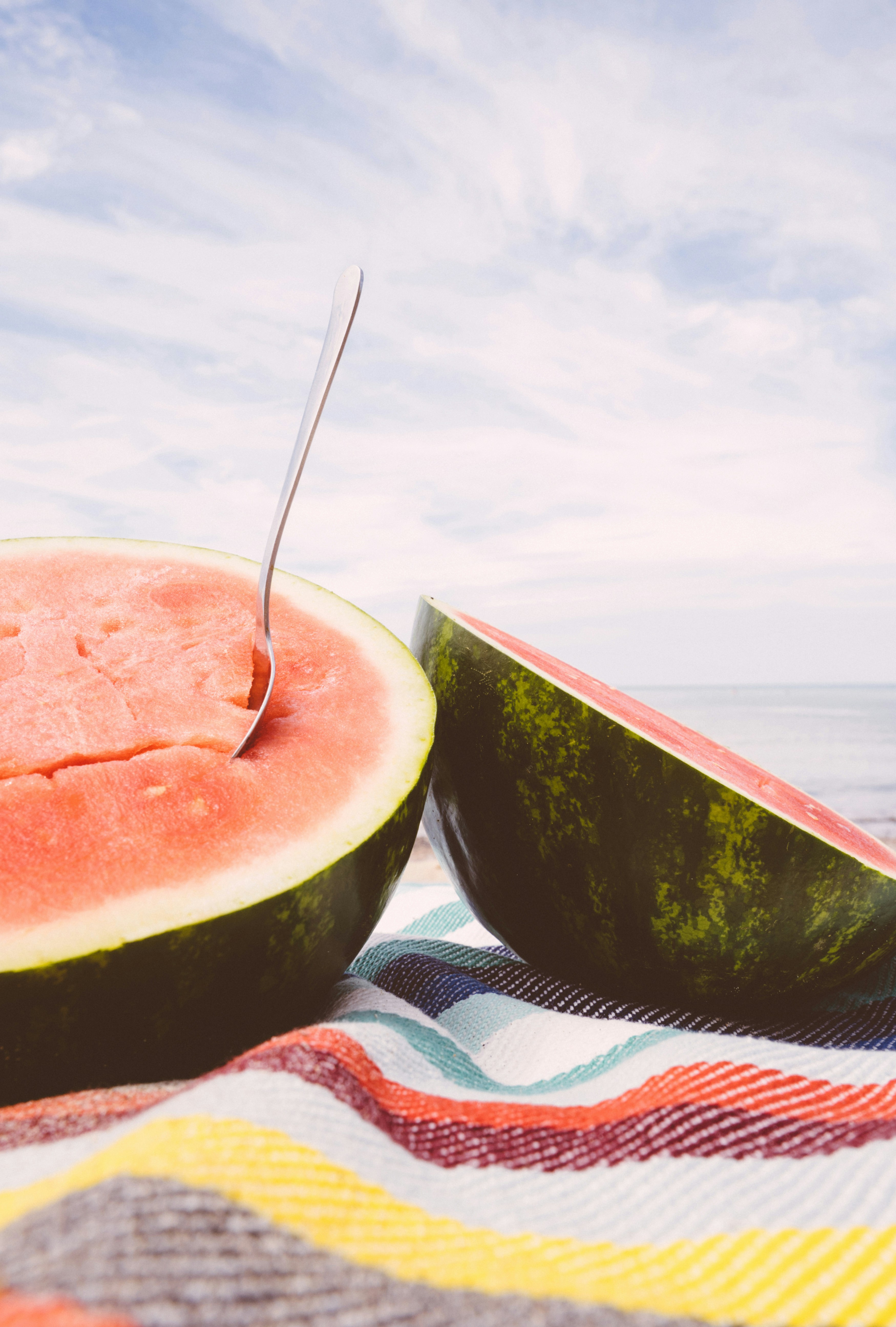 Watermelon beach snack on a color beach towel