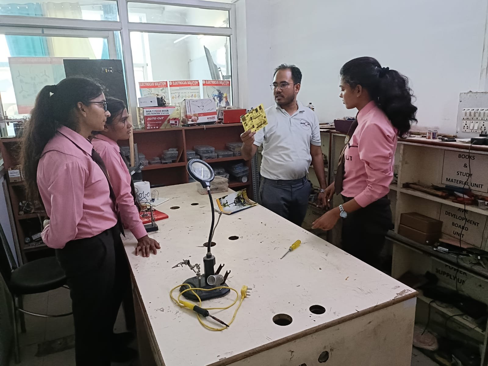 Full moon rising behind a house at night