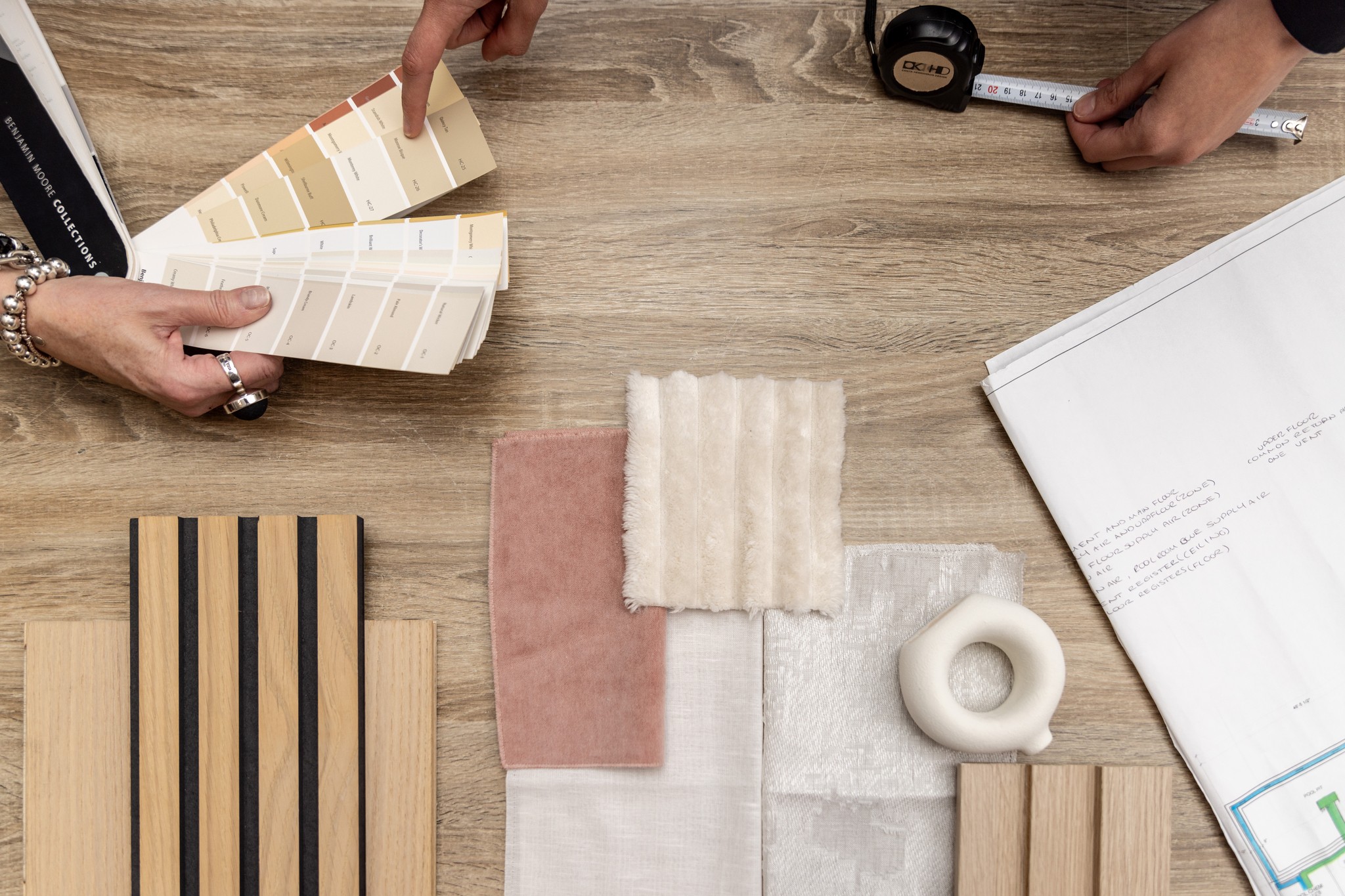 Image of KHD Homes design team selecting materials for luxury home renovations and interior design projects.