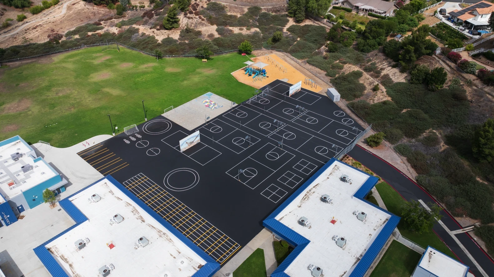 New school playground asphalt sealcoating project