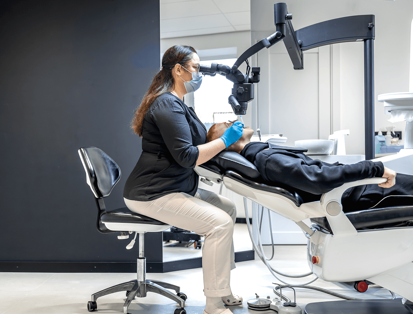 Patient receiving professional teeth whitening treatment