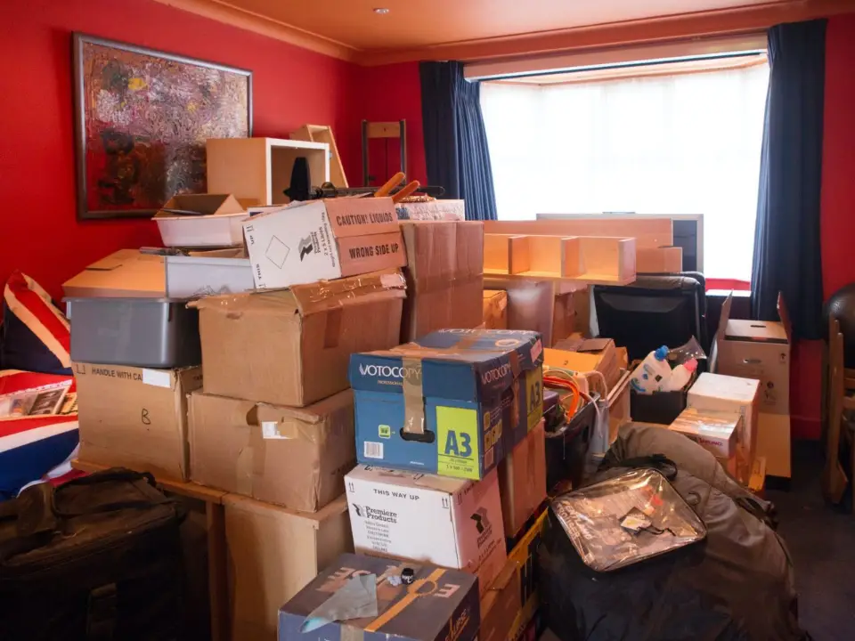 A room full of boxes in a haorders house.