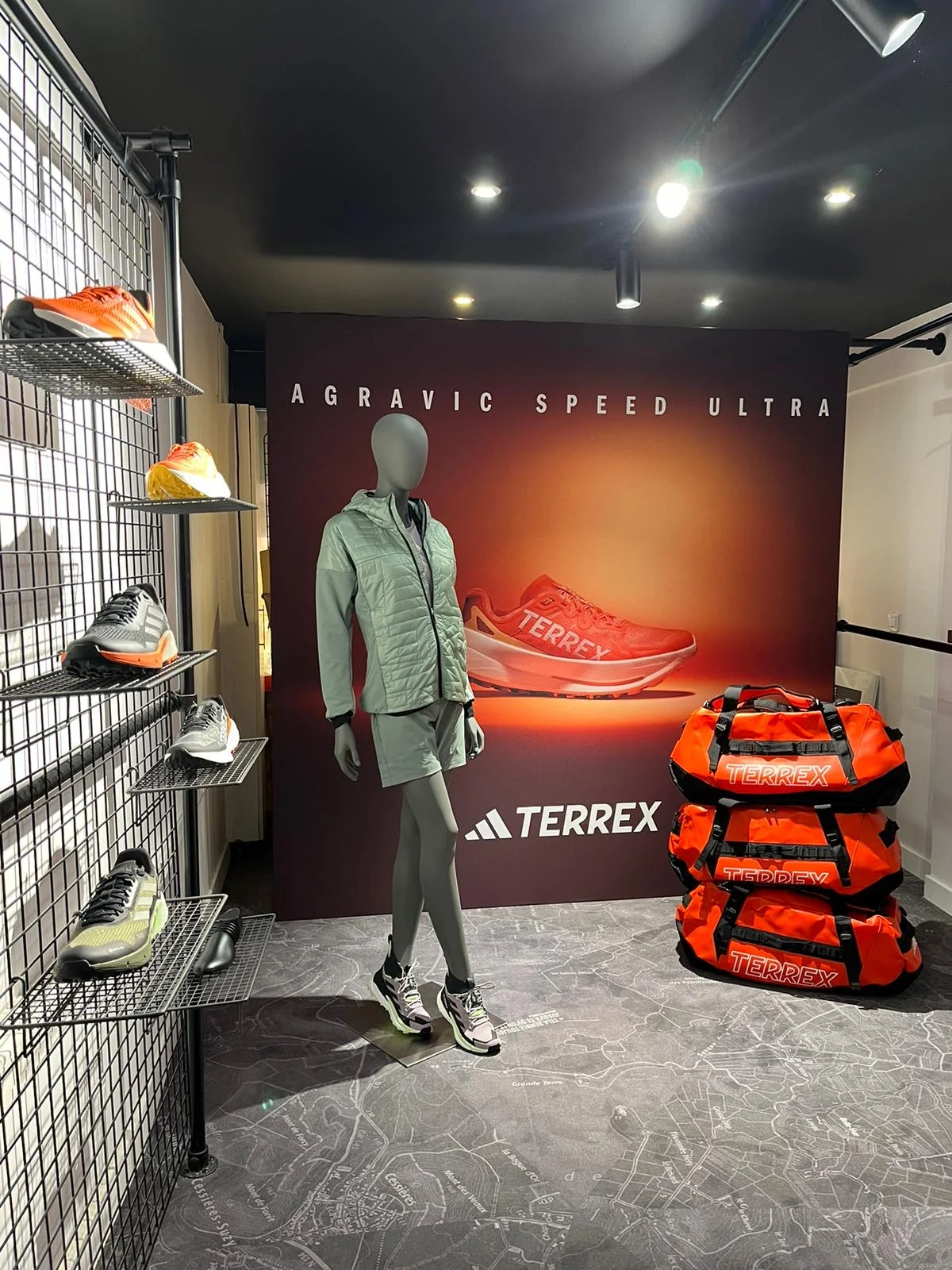 Adidas Terrex Agravic Speed Ultra installation at Tonton Outdoor - visual wall and mannequin with products