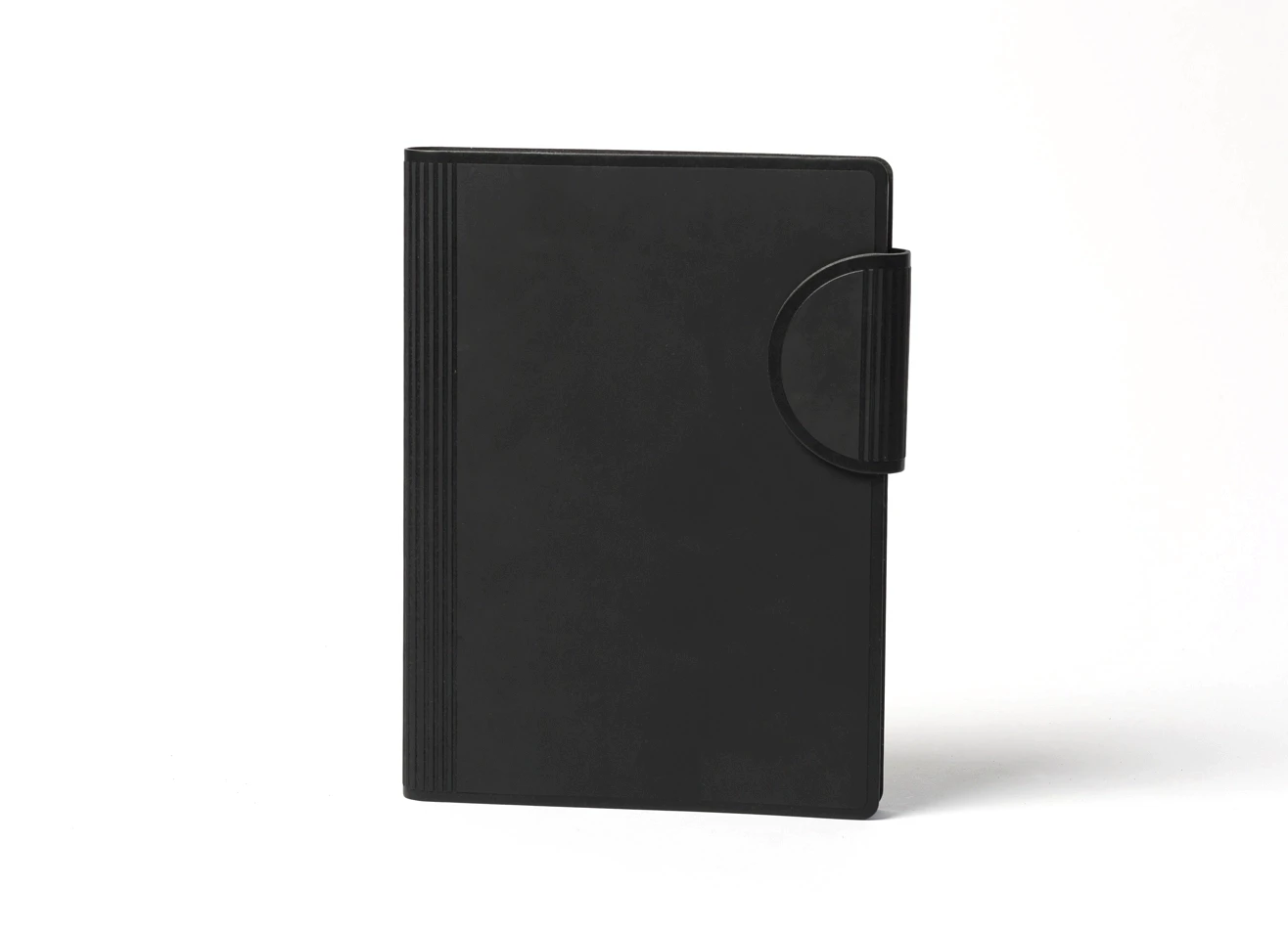 Black journal with curved strap closure and minimalist matte finish