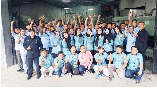 Construction workers review plans at a job site.