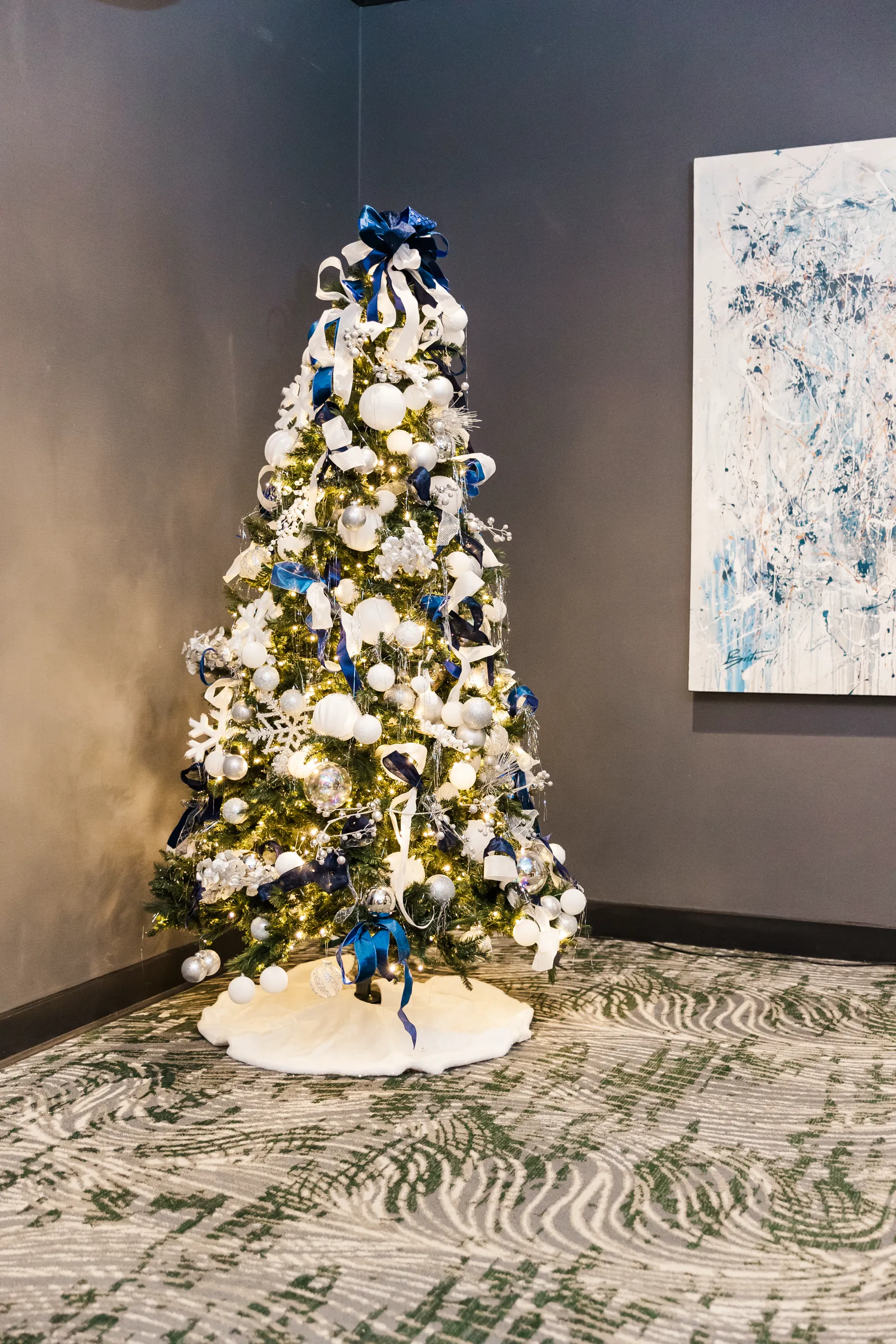 Luxury table setting by Sarah Overall Events with pink embroidered napkins, gold-rimmed plates, floral arrangements, and personalized menus in Shreveport.