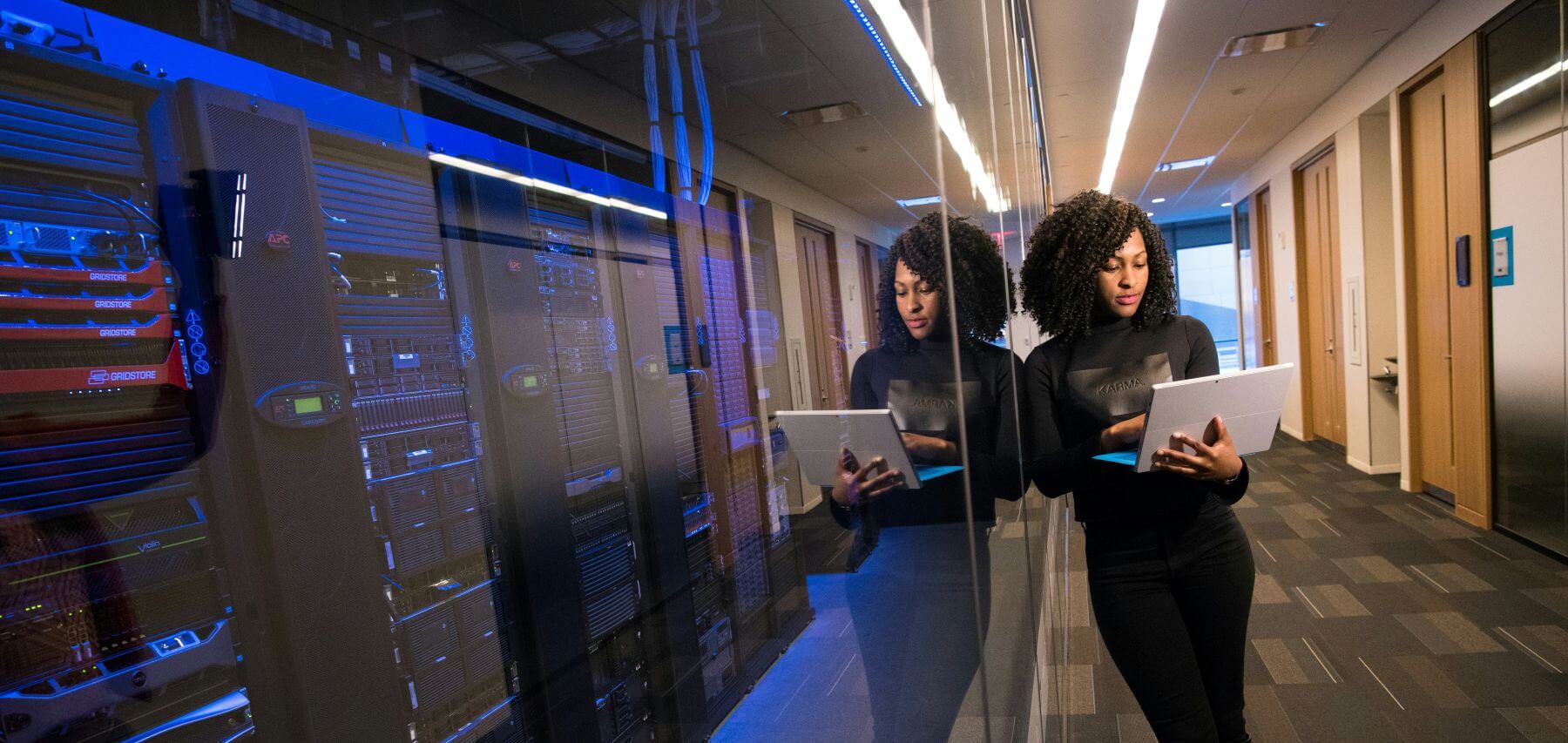 Woman providing IT services working at a data centre