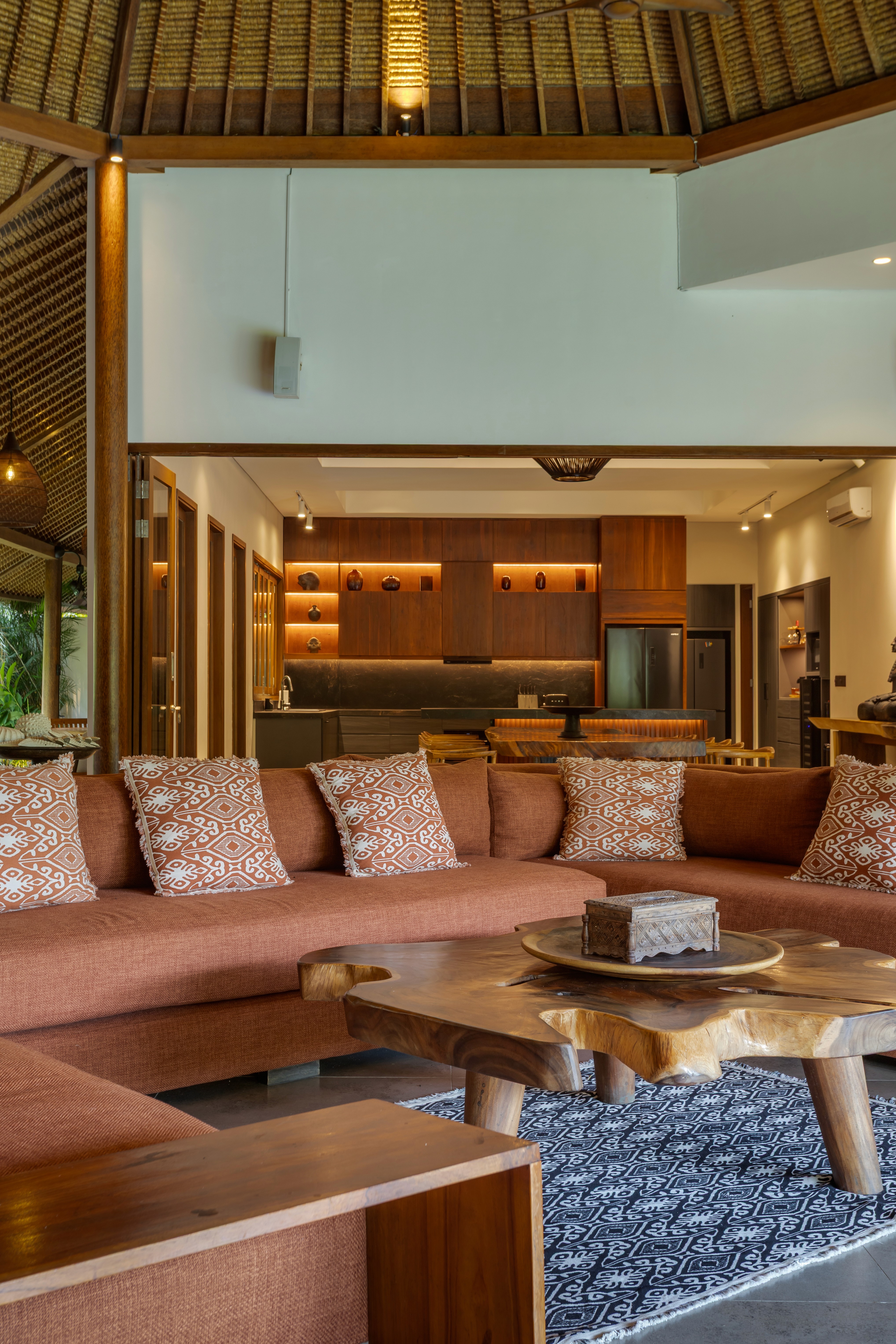 Modern house with elevated glass balcony and hillside view